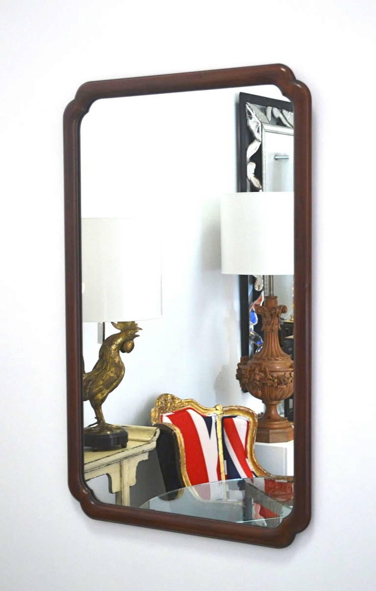 Glamorous midcentury wall mirror by John Widdicomb, circa 1960s. This stunning Asian inspired walnut mantel mirror is in original excellent condition, aged in a wonderful rich patina.