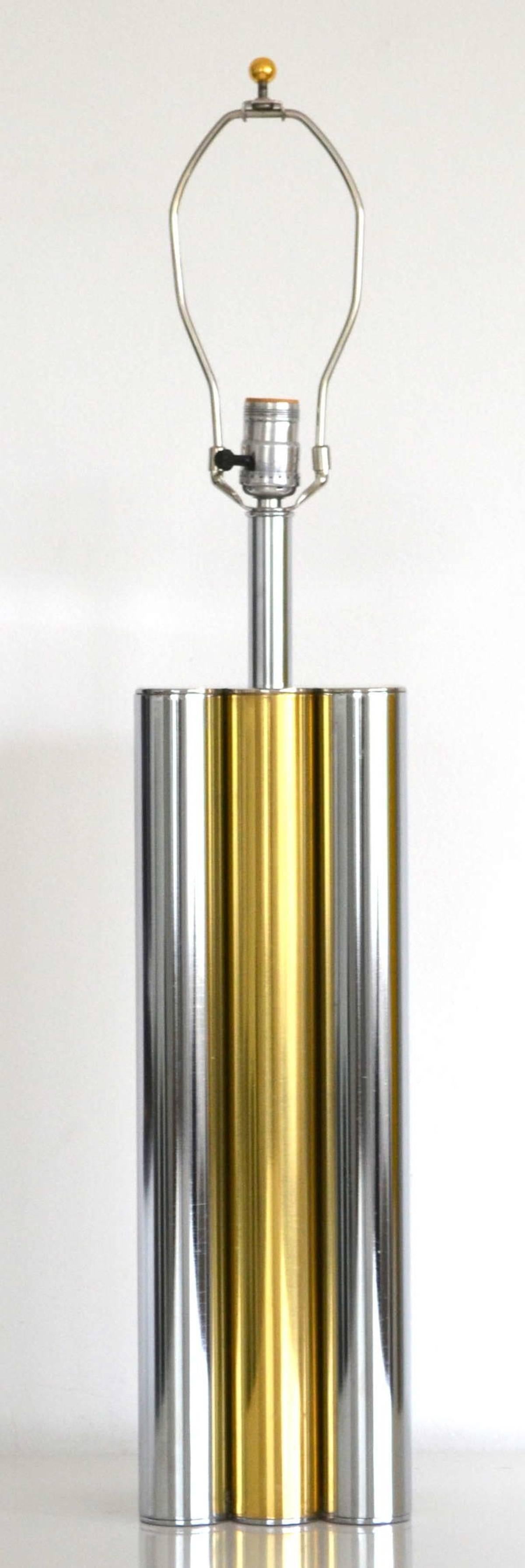 Striking midcentury architecturally influenced column form table lamp, circa 1960s-1970s. This sleek tubular lamp is composed of alternating chrome and brass cylinders. Shade not included.

Measurements:
31