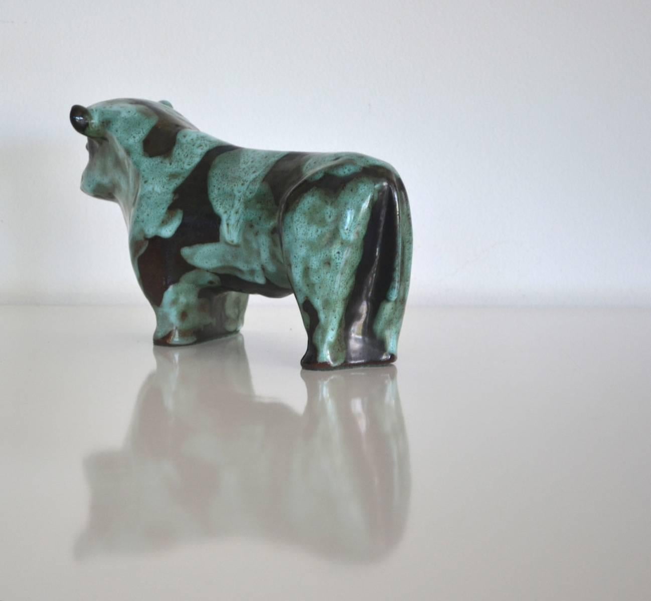 Striking Mid-Century hand thrown ceramic bull sculpture by Marianna von Allesch, circa 1950s-1960s. This incredible aqua and ebony matte glazed sculpture is organic in form and signed on the bottom. The bull is in original pristine condition.
