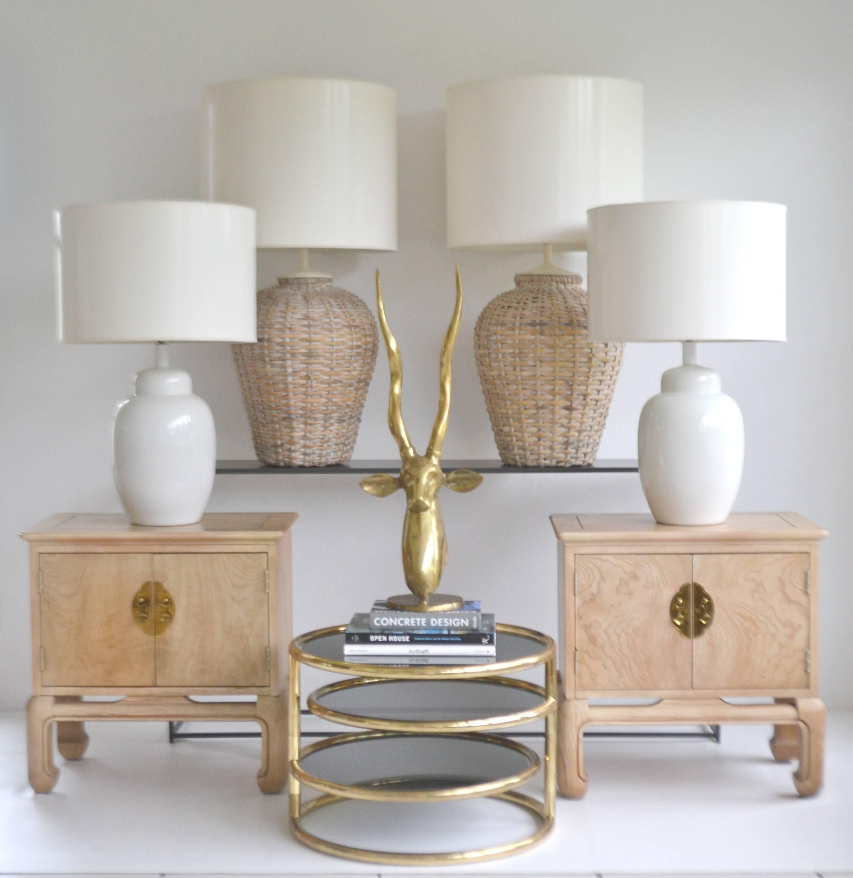 Striking pair of midcentury Blanc de Chine ginger jar form table lamps, circa 1960s-1970s. These artisan thrown white glazed lamps are wired with brass fittings. Shades not included.
Measurements: Overall: 28