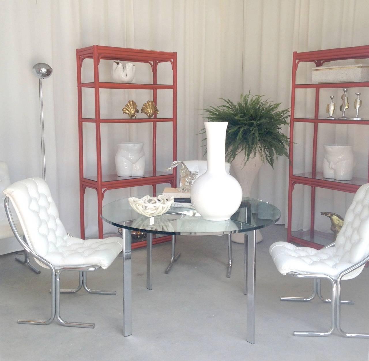 Striking set of six midcentury master crafted chrome white tufted dining chairs in the style of Milo Baughman, circa 1960s-1970s. These stunning side chairs are accented with sleek tubular chrome frames.