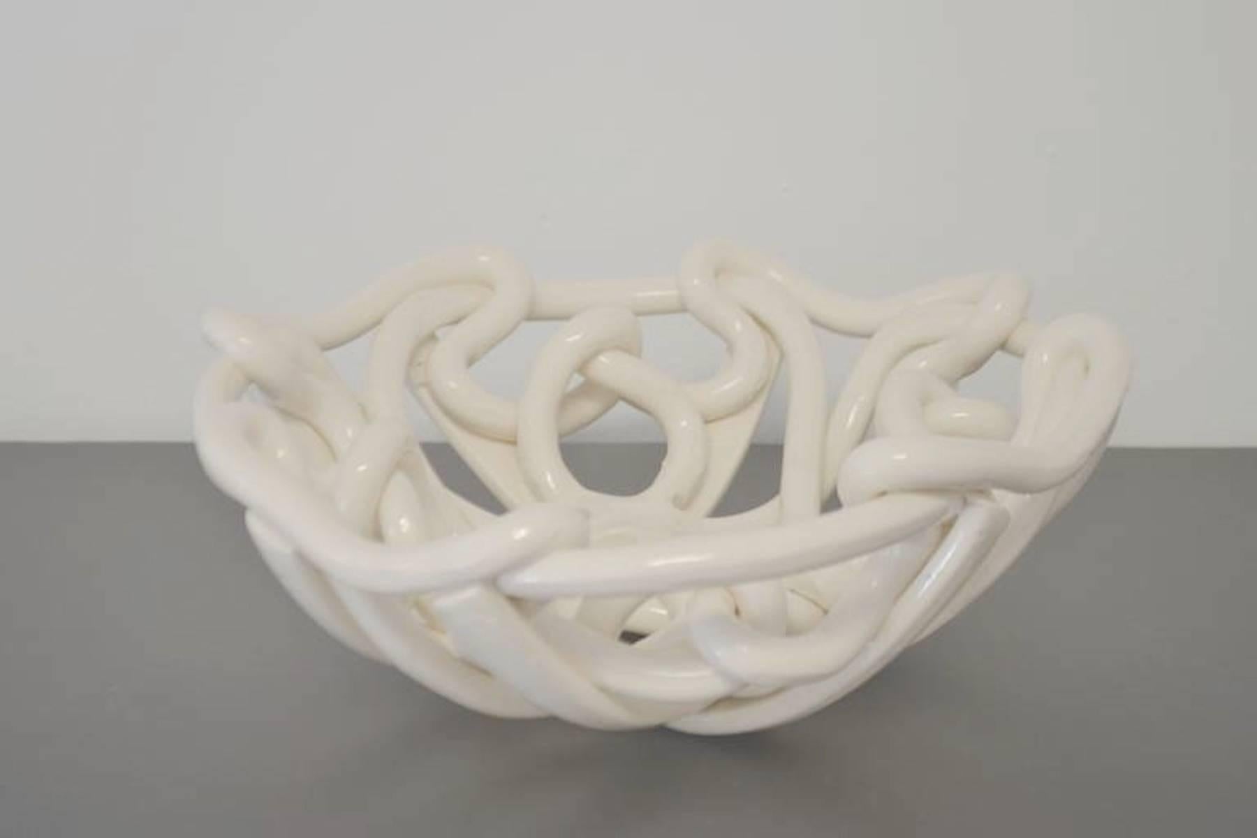 Stunning midcentury white glazed ceramic free-form bowl, circa 1960s. This organic hand thrown bowl is composed of woven interlacing strands.