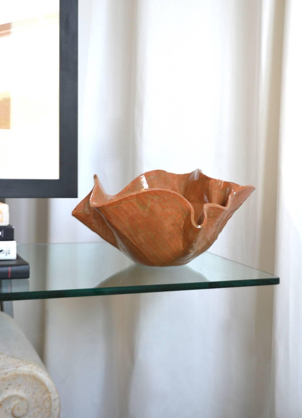 Stunning Mid-Century sculptural hand thrown organic handkerchief form ceramic bowl with umber and sienna glazing, circa 1960s.

 