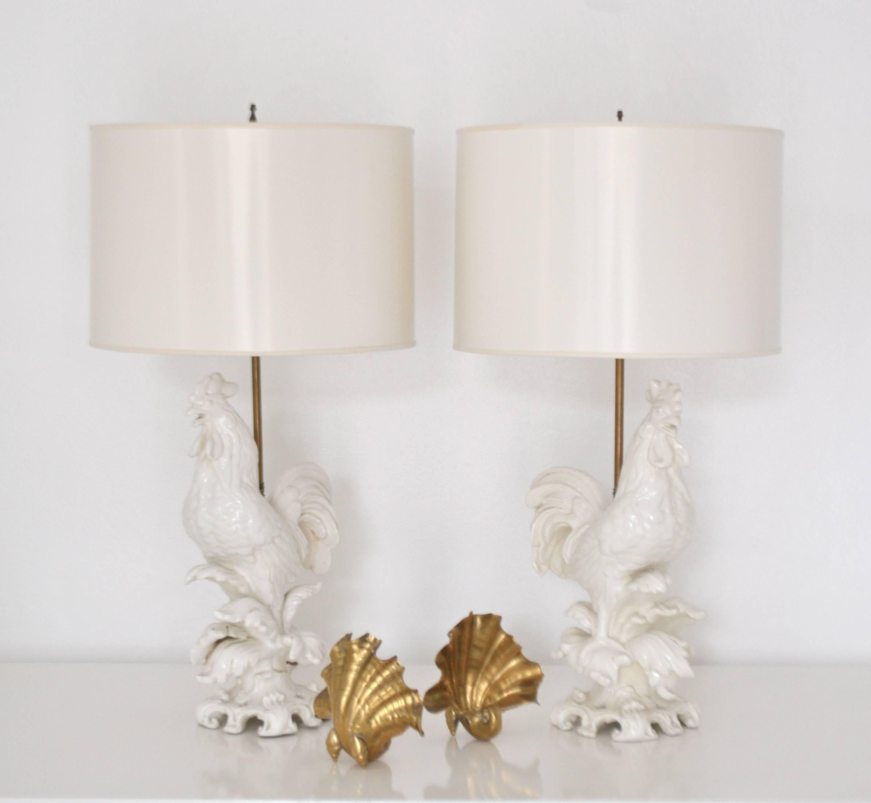 Stunning pair of midcentury Italian Blanc de Chine ceramic rooster form table lamps, circa 1950s-1960s. These highly decorative hand thrown figural lamps are rewired with brass fittings and silk cords. Shades not included.