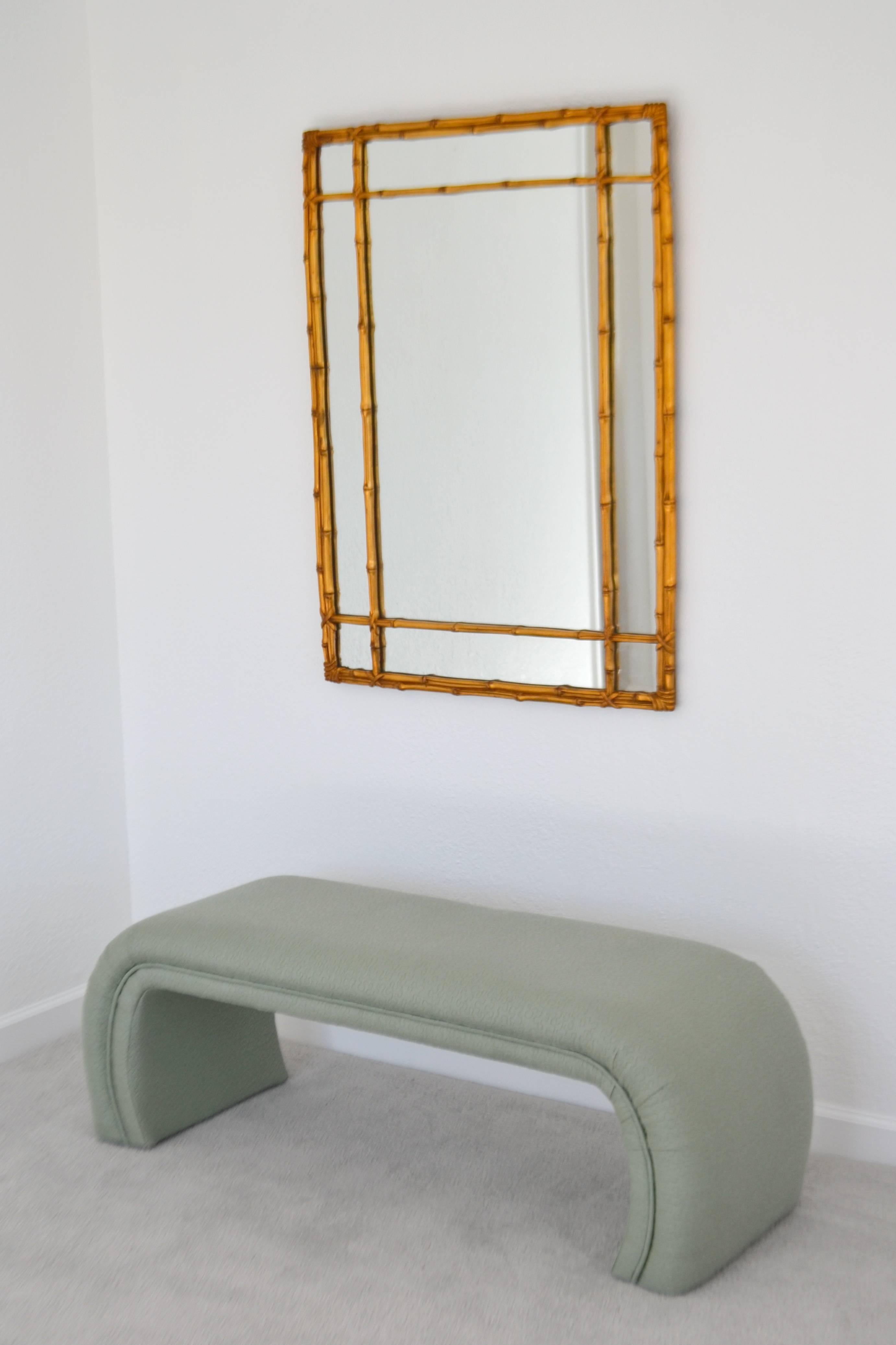 Glamorous Hollywood Regency faux bamboo gilt rectangular wall mirror, circa 1950s-1960s.