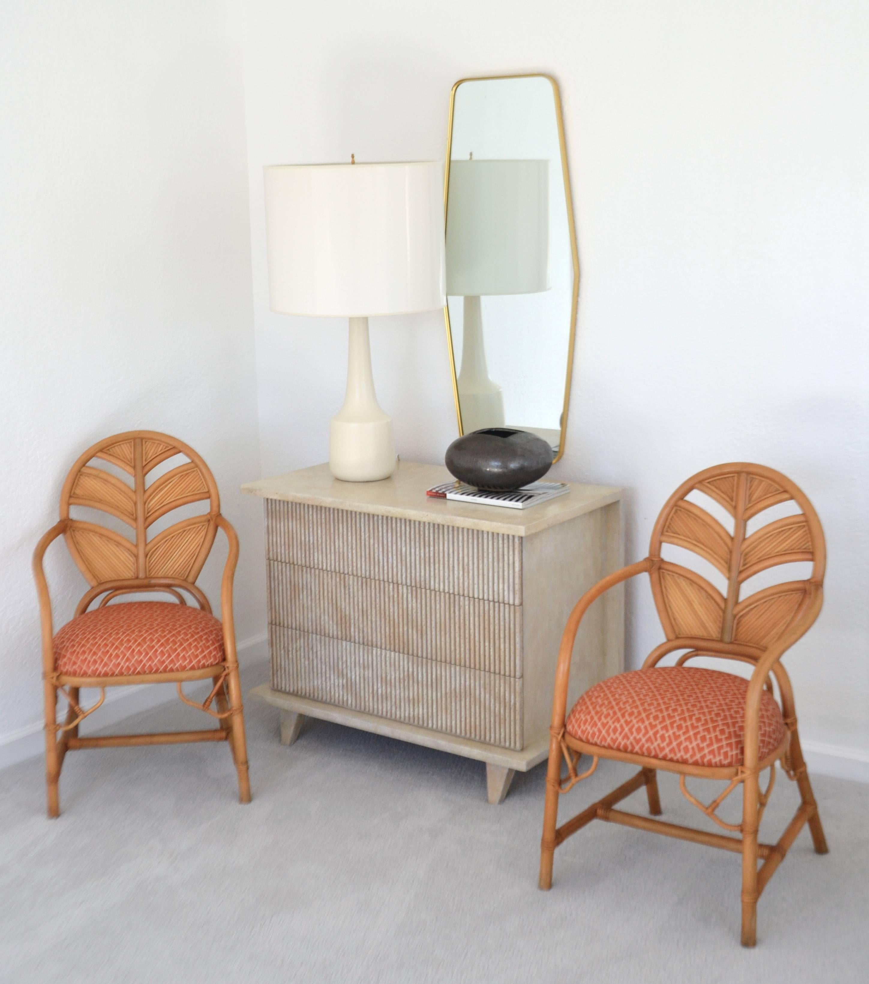 Striking Mid-Century chest, circa 1950s. This sculptural three-drawer chest is designed with a mahogany case and accented with textural reeded drawer fronts. The center hall cabinet retains its original cerused natural lacquered finish in excellent