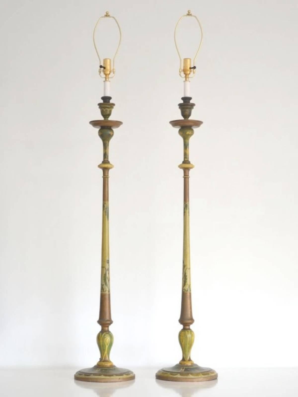 Stunning pair of Venetian hand-painted carved wood candlesticks table lamps, circa 1920s. These artisan crafted Italian lamps are rewired with brass fittings. Shades not included.
Measurements: The height of the lamps from the base to the top of the
