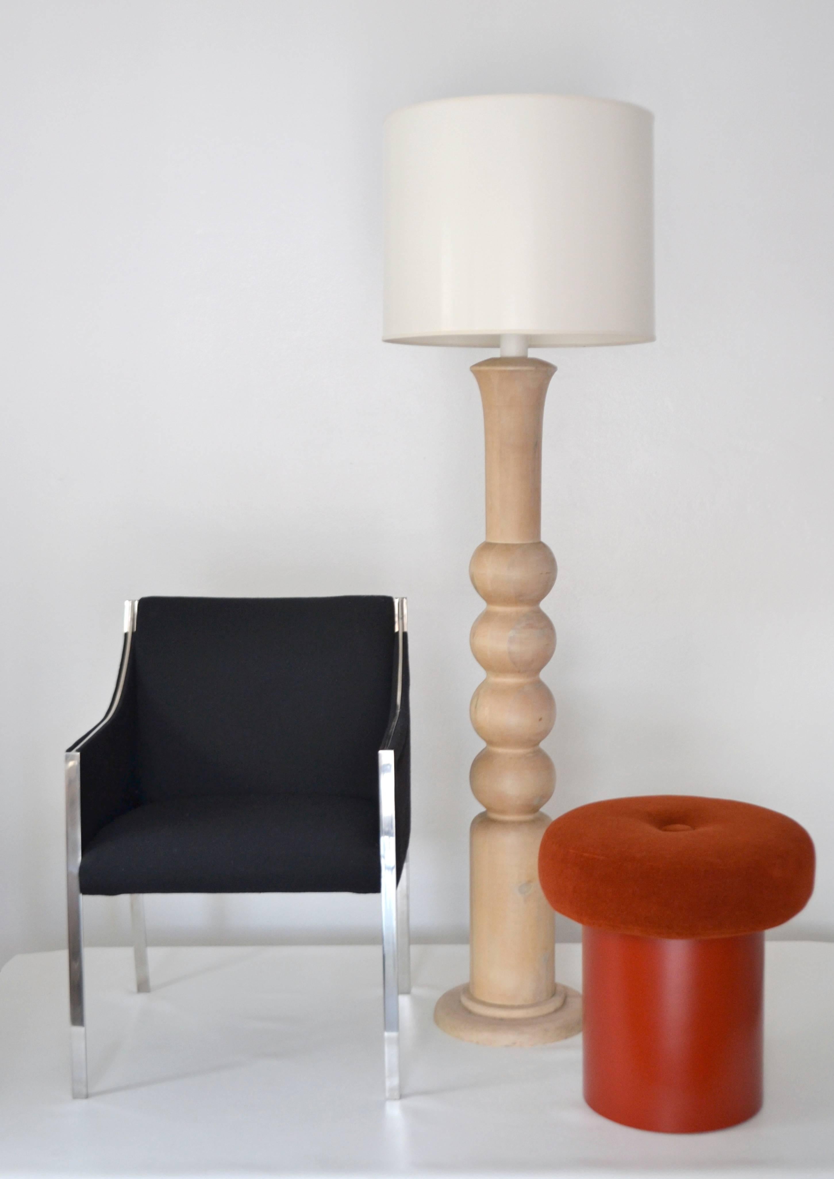Striking Mid-Century natural turned wood candlestick floor lamp, circa 1950s-1960s. This sculptural artisan crafted hand-turned standing lamp is wired with brass fittings. Shade not included. 
Measurements: The height from the base to the top of the