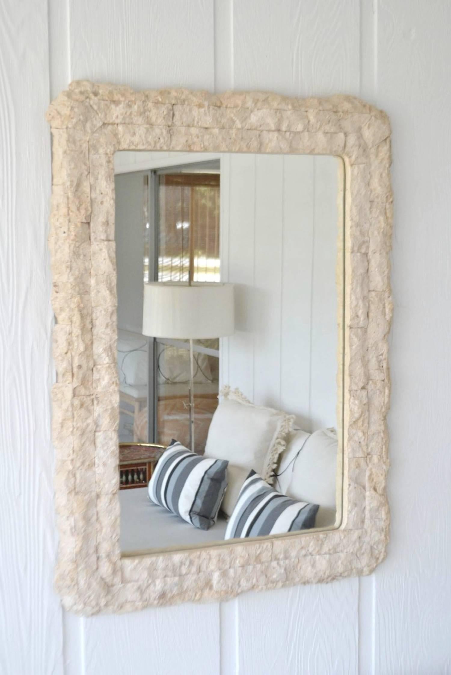 Postmodern tessellated wall mirror, circa 1970s-1980s. This stunning mantel mirror is designed with rounded corners and a rough-hewn finish.