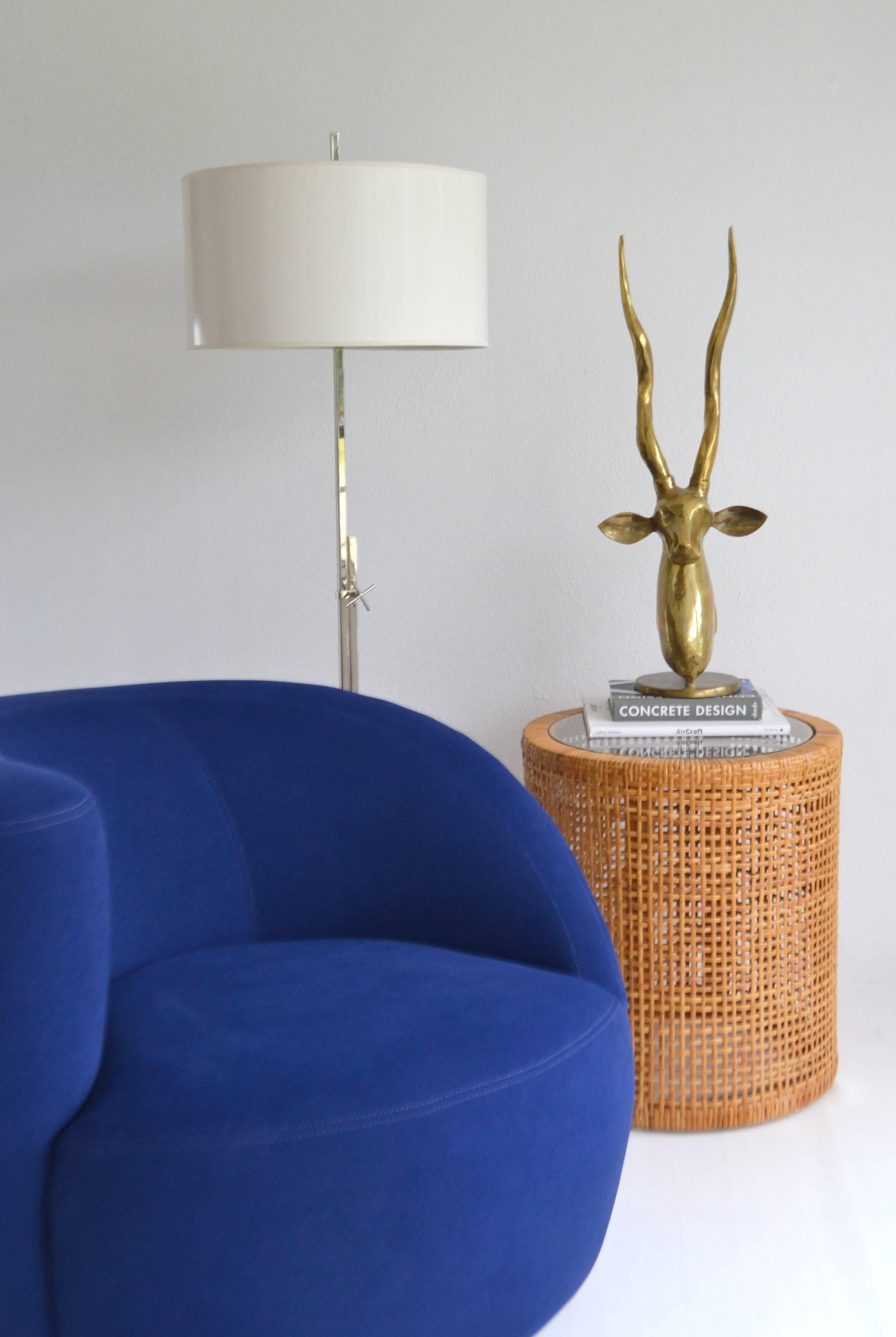Striking Mid-Century woven cane drum form side table, circa 1960s -1970s. This sculptural open weave end table / occasional table is finished with an inset glass top. 
