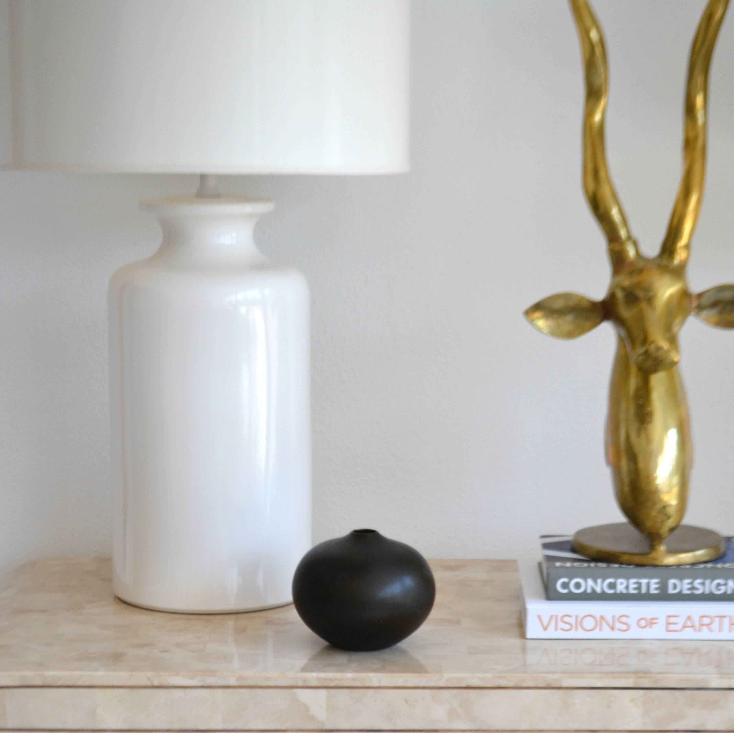 Striking Mid-Century ceramic vase by Knabstrup, circa 1950s.
This sculptural Danish vessel is fired in a black-brown glaze in an eggshell finish.