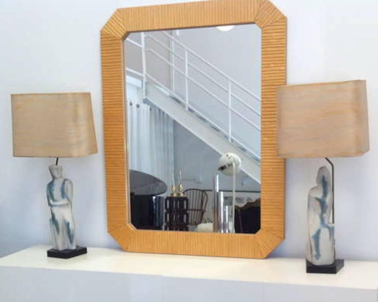 Striking postmodern faux bamboo carved wood mirror, circa 1970s-1980s.

Outside dimensions: 53.25