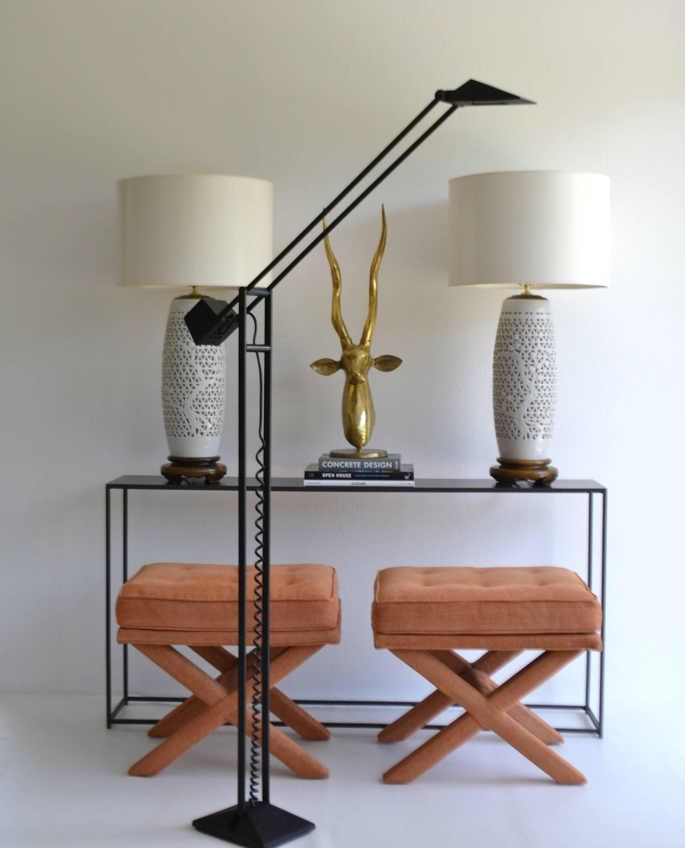 Architectural Postmodern articulated floor lamp by Artup, circa 1980s. This sculptural and graphic Memphis style black lacquered steel and cast iron standing lamp is designed with numerous articulating pivot points allowing for various