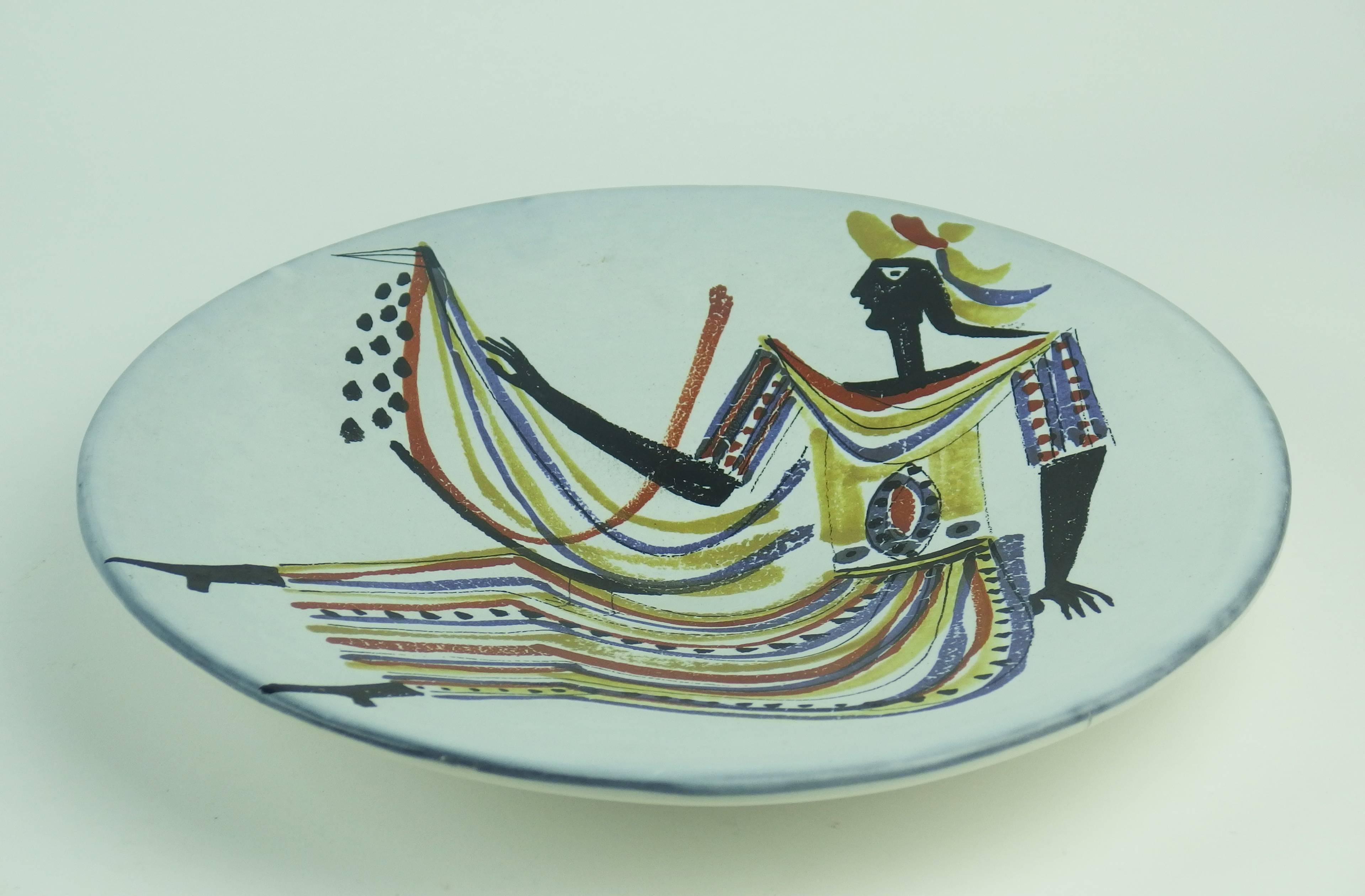 A decorative plate with a modern figurative design. Signed Capron Vallauris