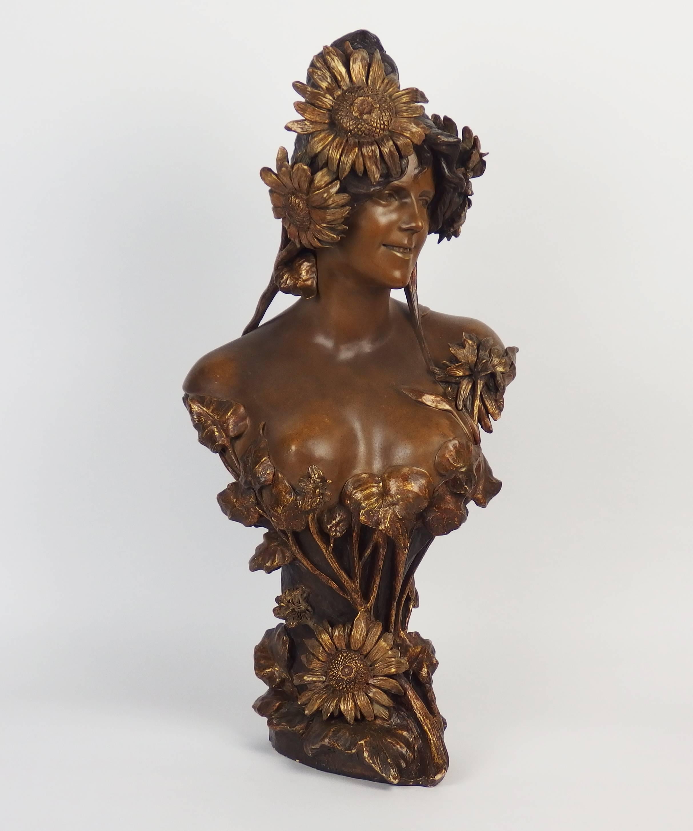 A brown and gold terracotta, Art Nouveau bust edited by Friedrich Goldscheider and signed A Bertrand.