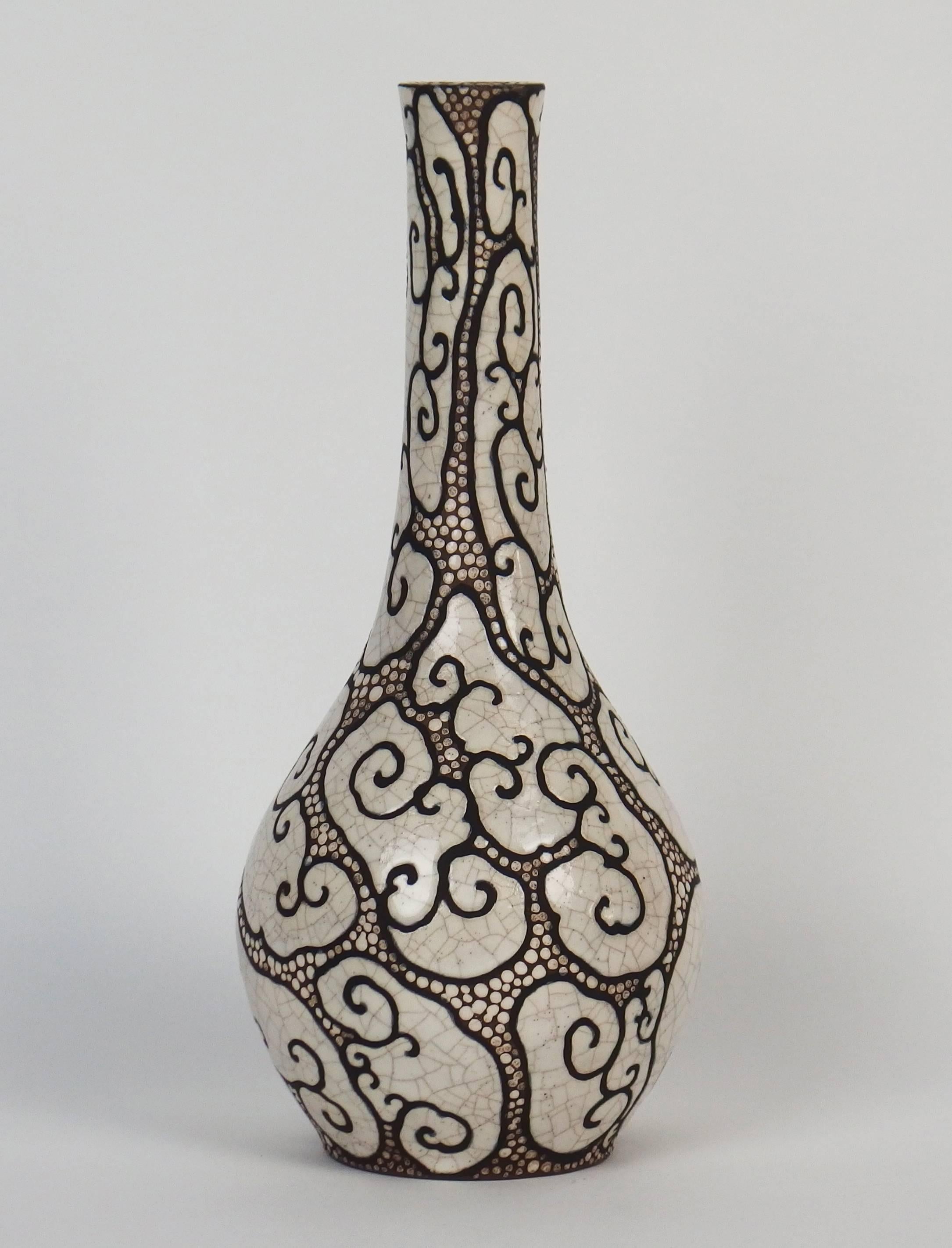 A Chinese style vase with brown ringed crackled white patterns. Signed Raoul Lachenal.