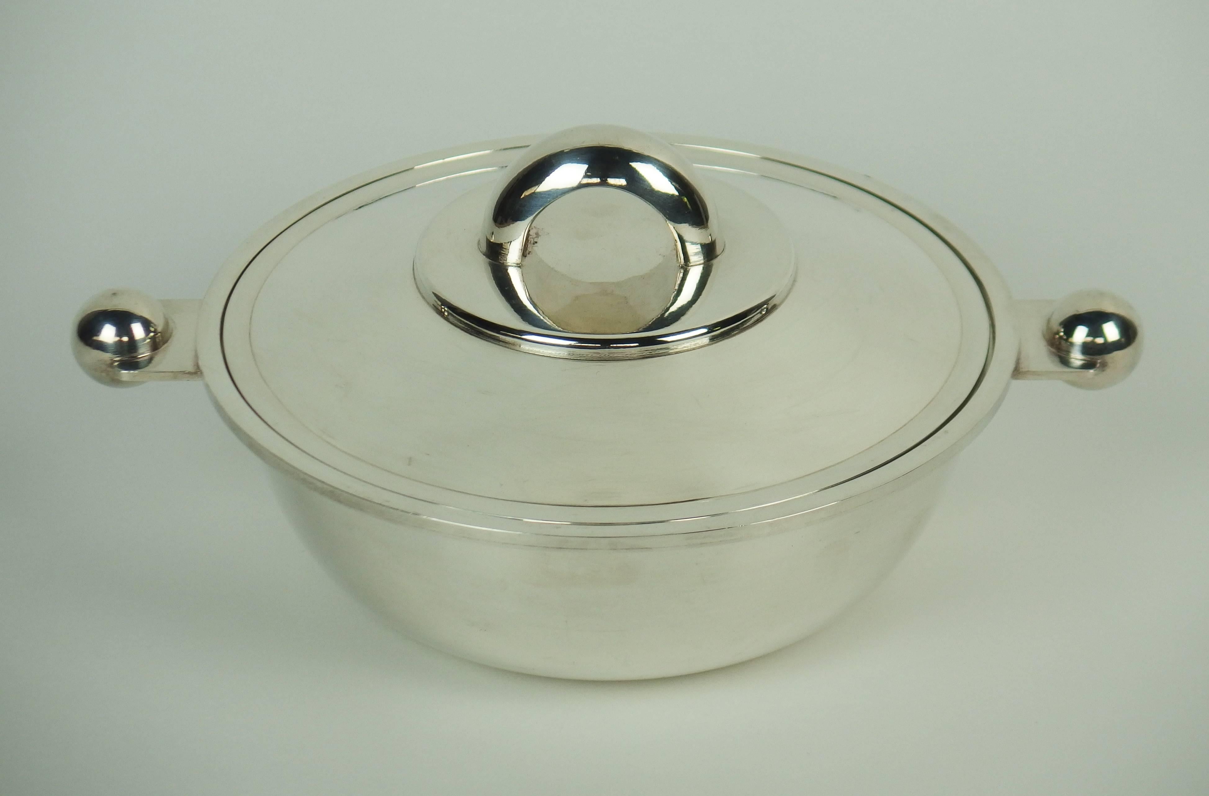 This beautiful silver plated tureen or vegetable dish edited by Christofle was, initially created by Luc Lanel for the ocean liner Le Normandie in 1934.