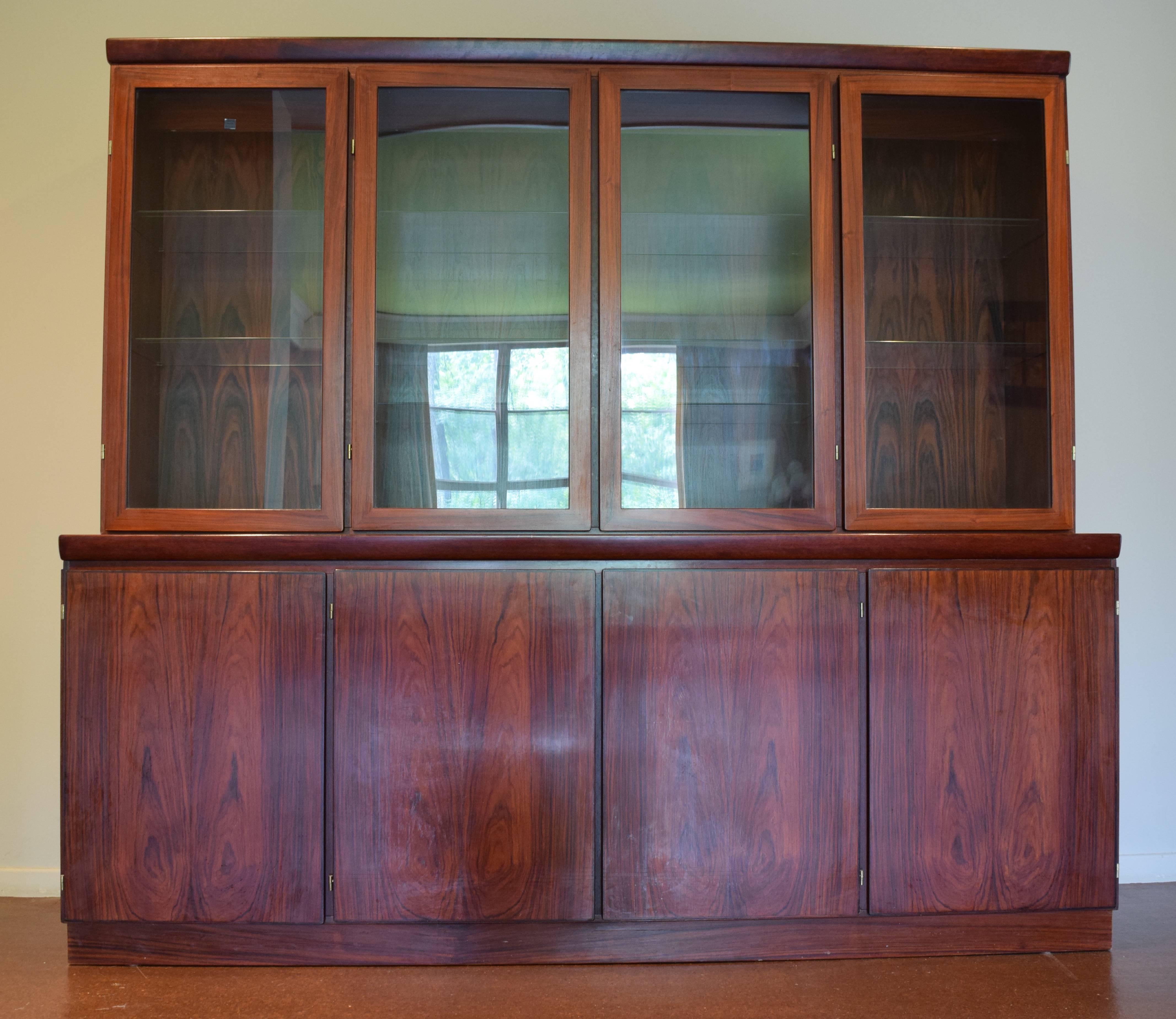 **RUNNING OUT OF WAREHOUSE SPACE...REDUCED FOR QUICK SALE!** Handsome two-piece Danish modern cabinet plus sideboard and buffet in rosewood. Top features interior lighting and ten adjustable glass shelves with plate grooves; base includes interior