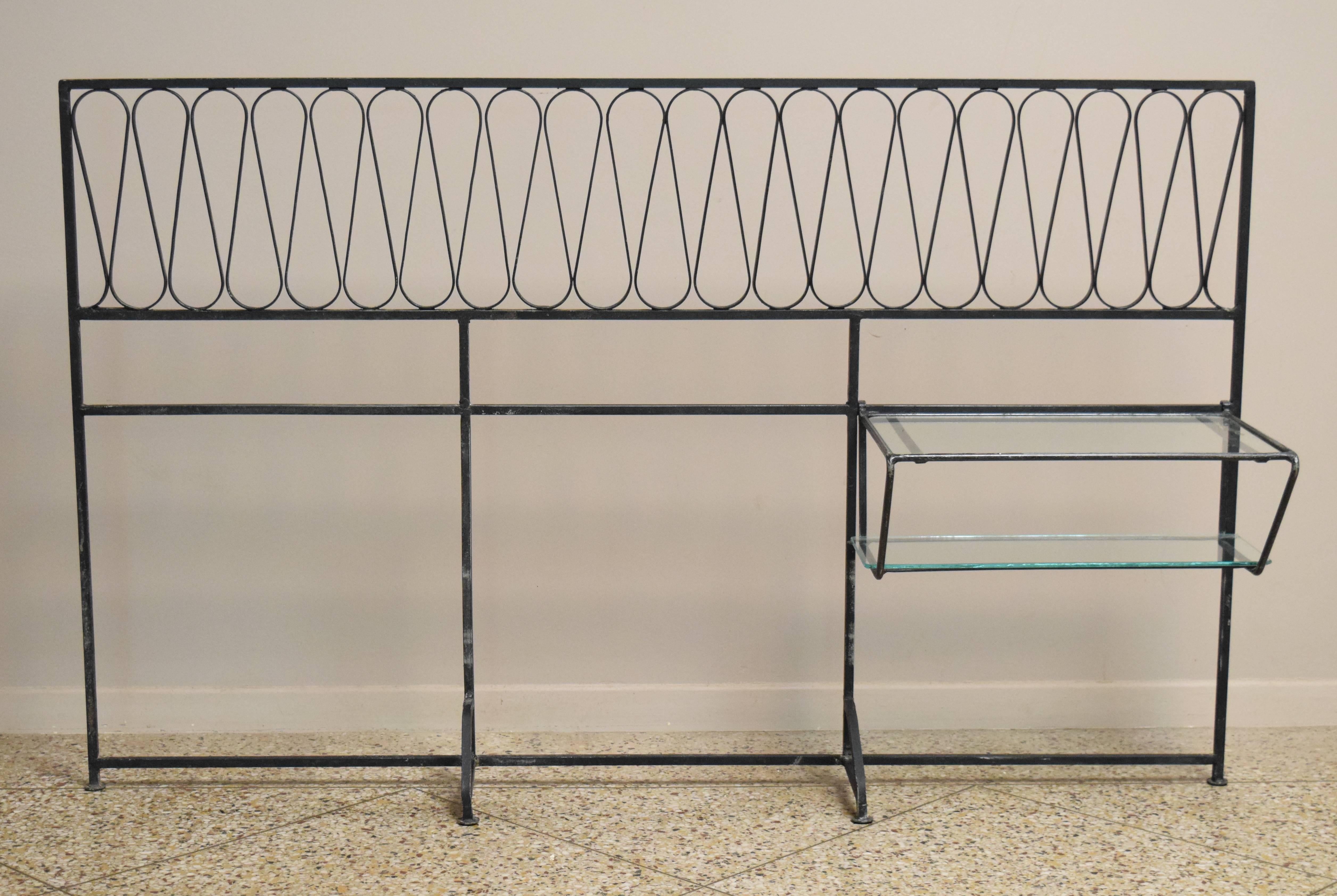 Store closing-- last day is 7/31. Offers welcome! Wrought iron headboard sized to fit either a queen bed or a twin bed if used alongside detachable, two-tiered shelving piece as shown in vintage Salterini ads. Other sizes also available.

Please