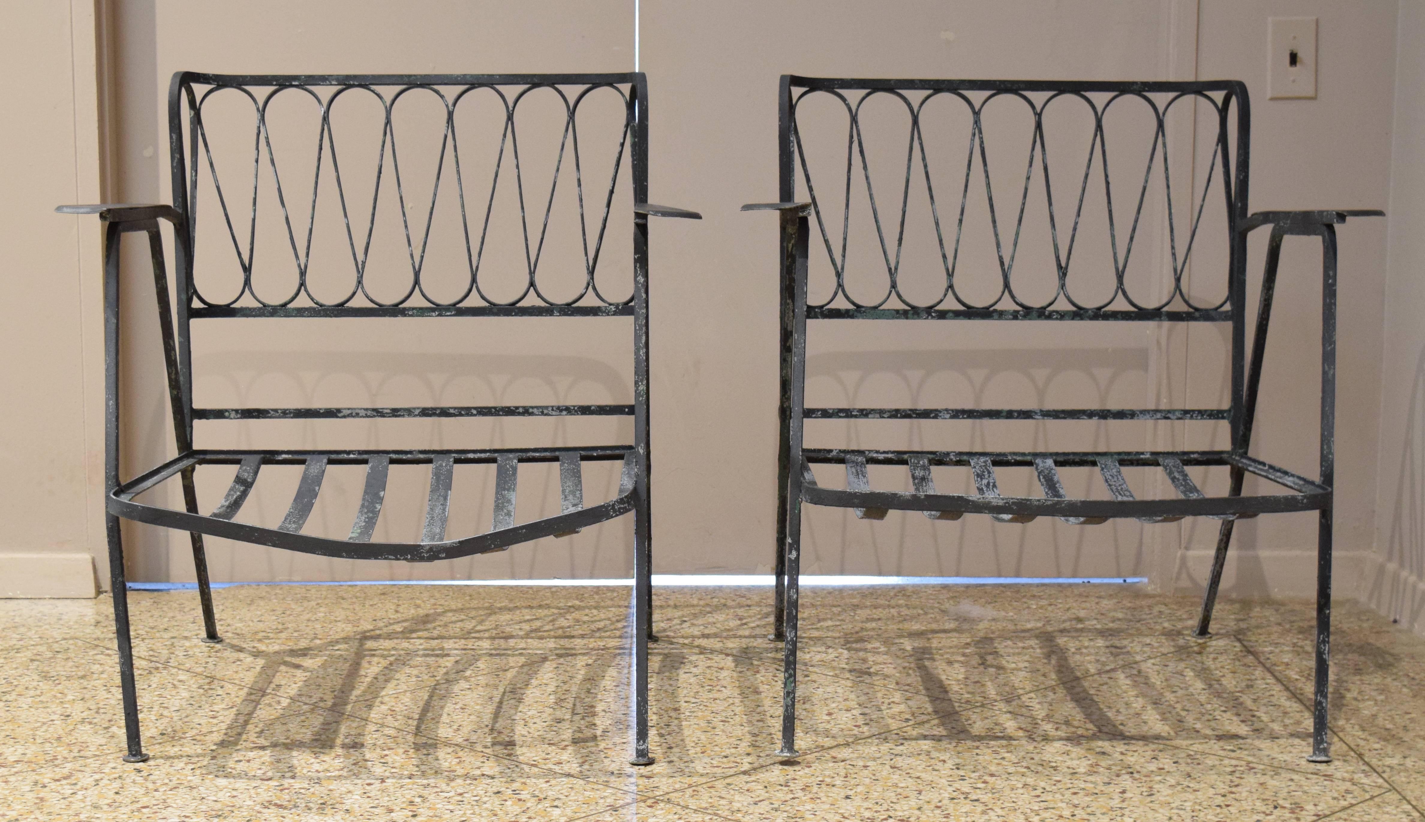Pair of wrought iron armchairs from the ribbon line designed by Maurizio Tempestini for the John B. Salterini Co. Buy one for $2000 or both for $3000.
