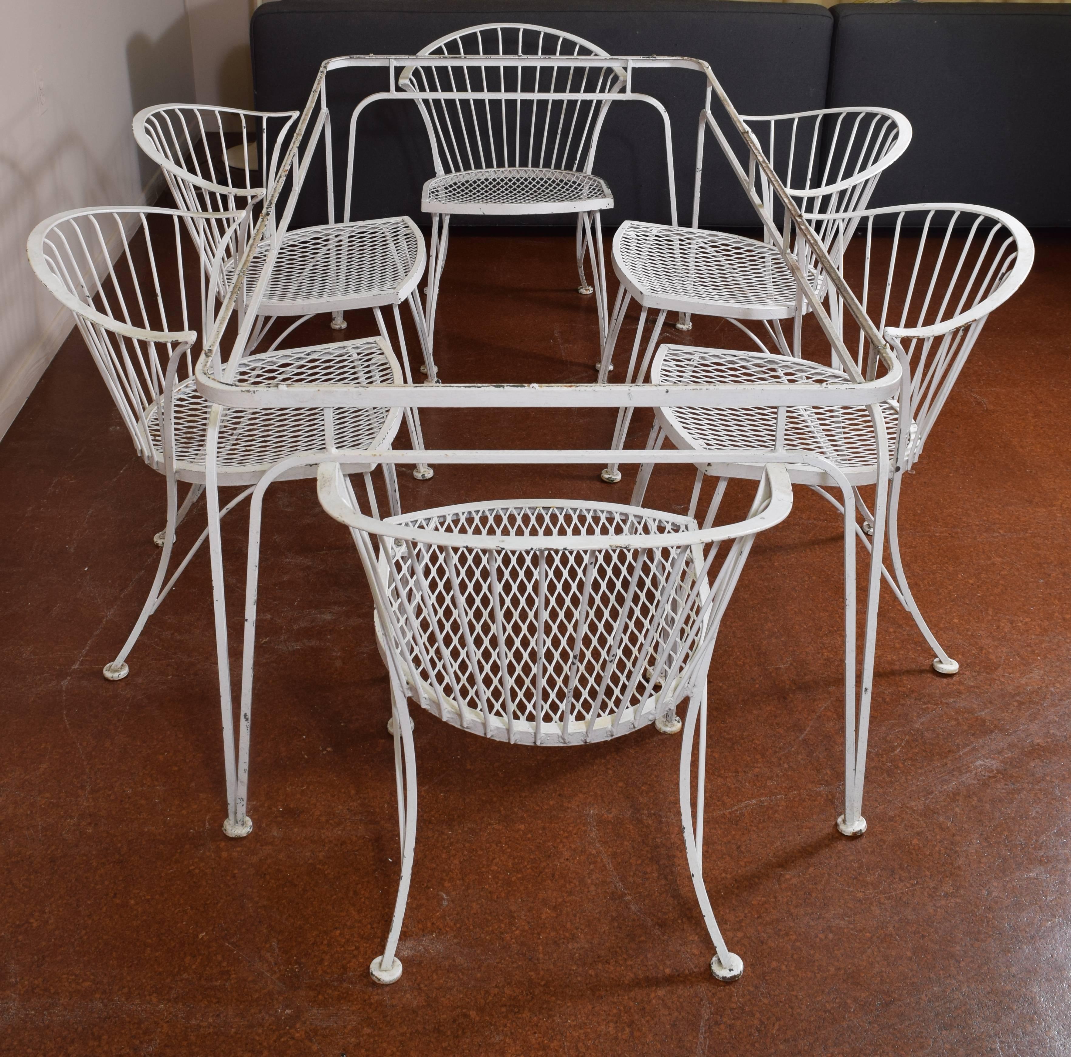 Vintage patio set by Russell Woodard featuring crisp, modern silhouettes in painted wrought iron.

Also available in a black five-piece set with 4' table.
