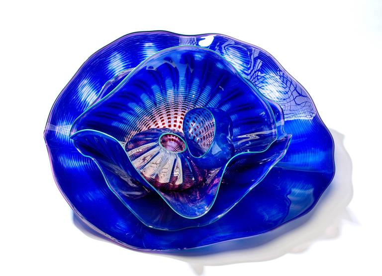 Five-Piece Cobalt Blue Sea Form Set with Turquoise Lip Wrap is a glass sculpture by master glass artist Dale Chihuly.

Dale Chihuly is credited with having revolutionized the studio glass movement with his ground breaking accomplishments.

His work