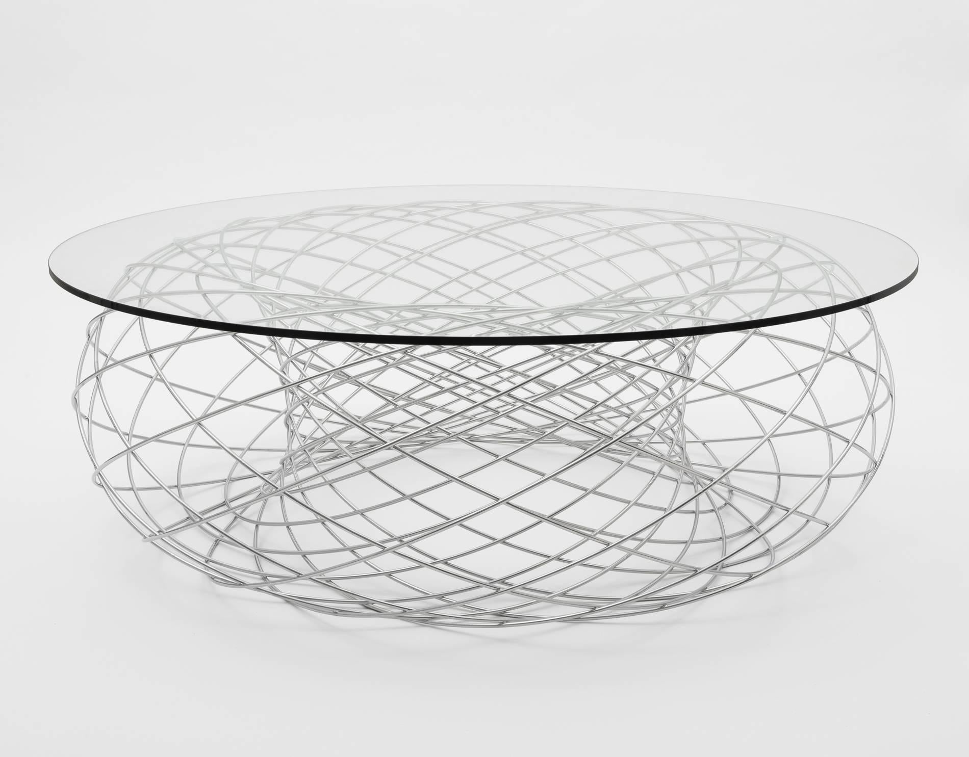 Philipp Aduatz
Villarceau Table, 2016
Powder coated steel, glass
18 x 55 x 55 in
Edition of 12 

Villarceau Table is a steel and glass table by Vienna based designer Philipp Aduatz.

The main influence of his work are scientific matters, these