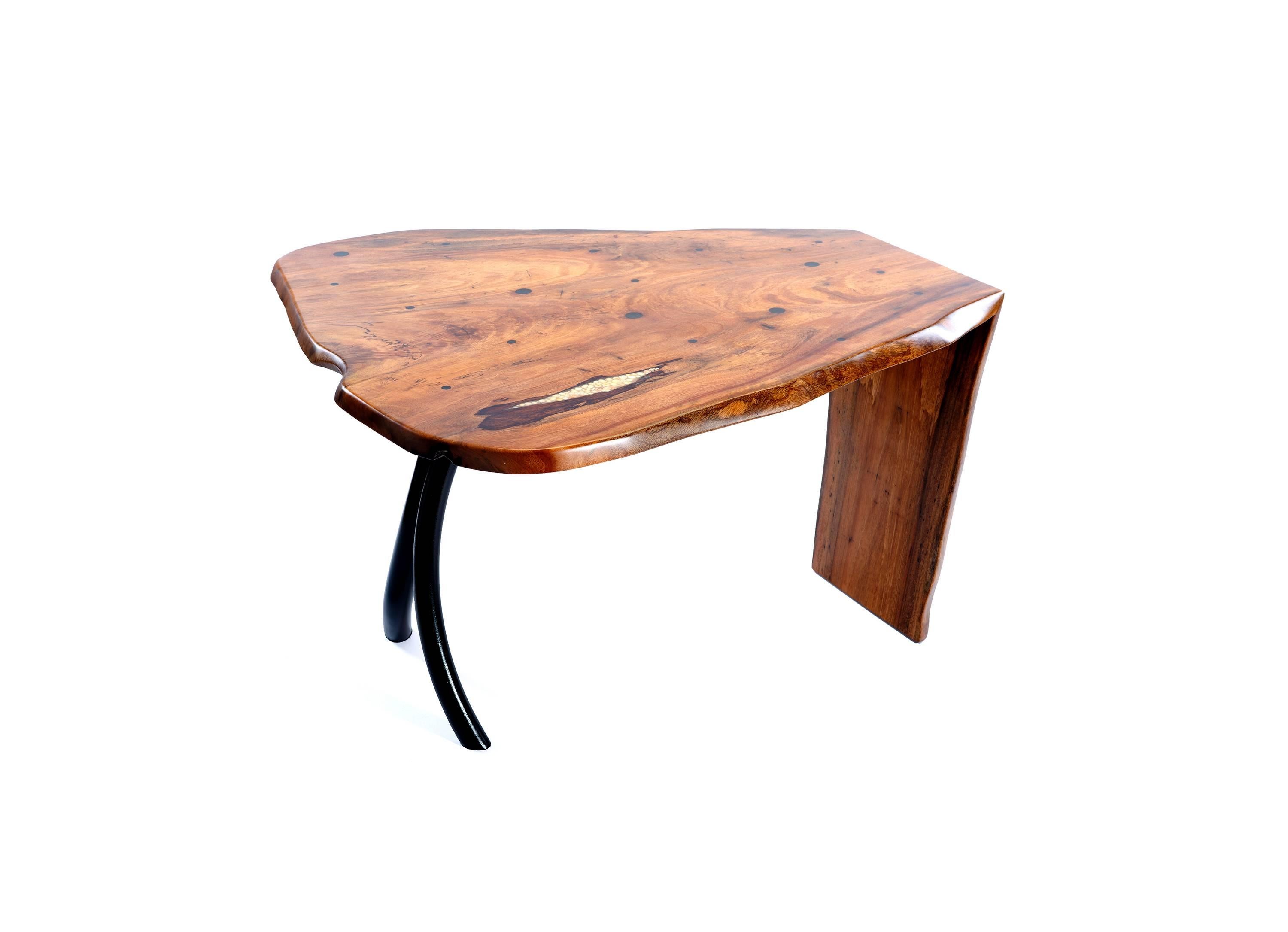 Untitled is a mango wood, black composite, pearl and forged steel table by Steve Tobin.

Steve Tobin is an American sculptor. Much of his work draws inspiration from nature, and the Christian Science Monitor has described his sculptures as