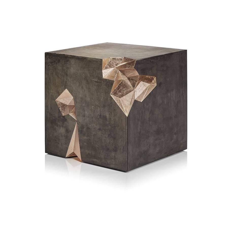 Monolith is a concrete and gold leaf stool or side table designed by Harow Studio.
 