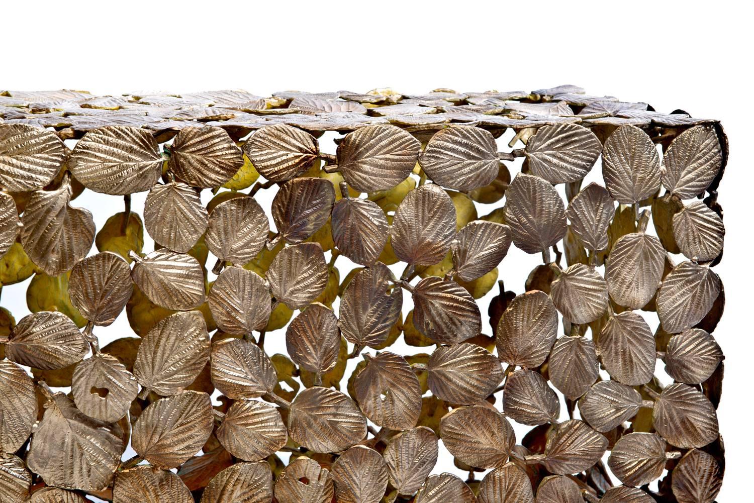Cast bronze winter hazel leaves welded together by hand make up this exquisite piece of design by artist Gregory Nangle. The forrest bench can be displayed indoors or outdoors.

The Gregory Nangle aesthetic explores what happens when geometry is