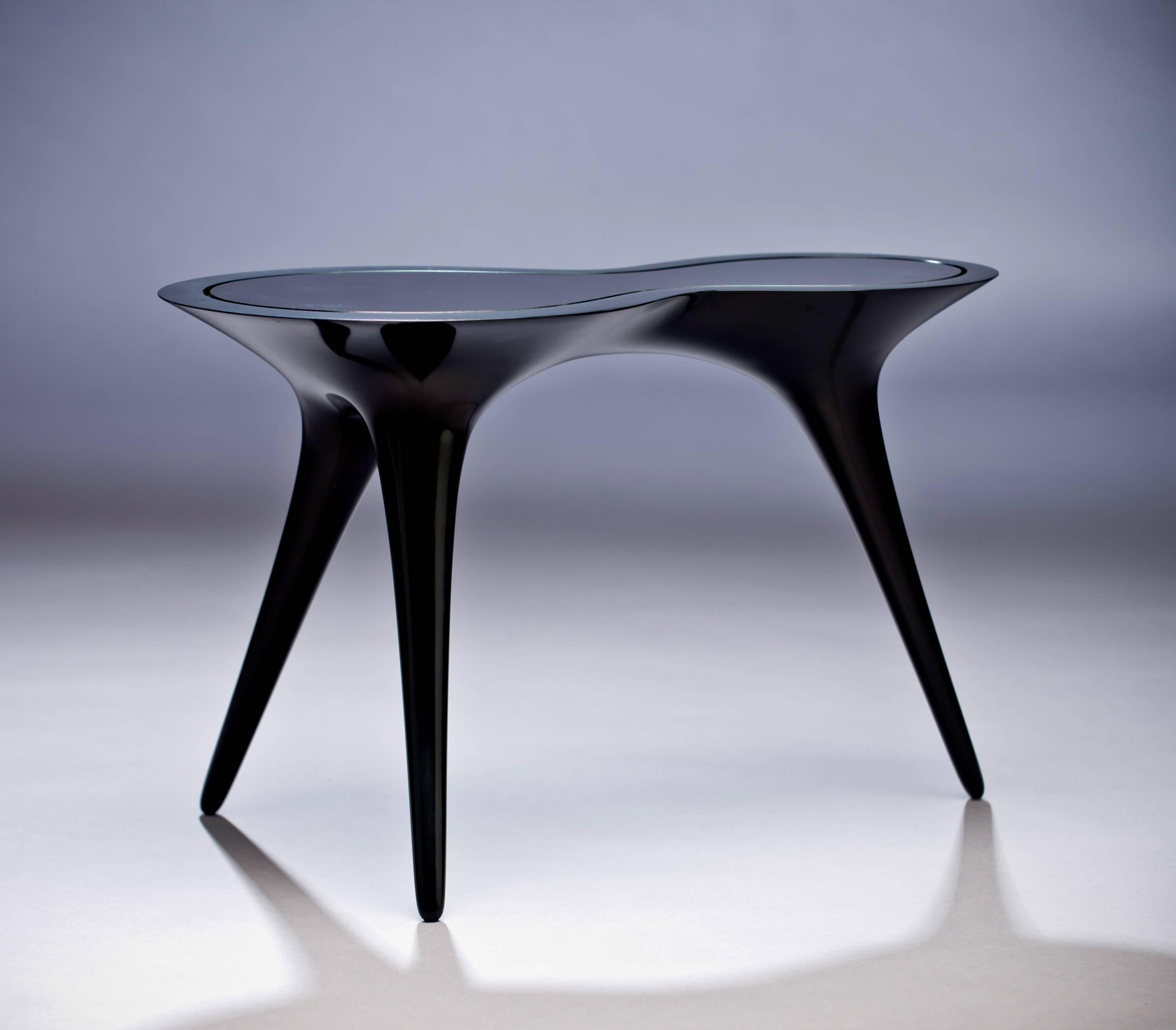 This exquisite set of side tables were created using corian and glass by German artist and designer Timothy Schreiber.

Timothy Schreiber initially trained in cabinet making in Germany before studying architecture and design in Germany and England,