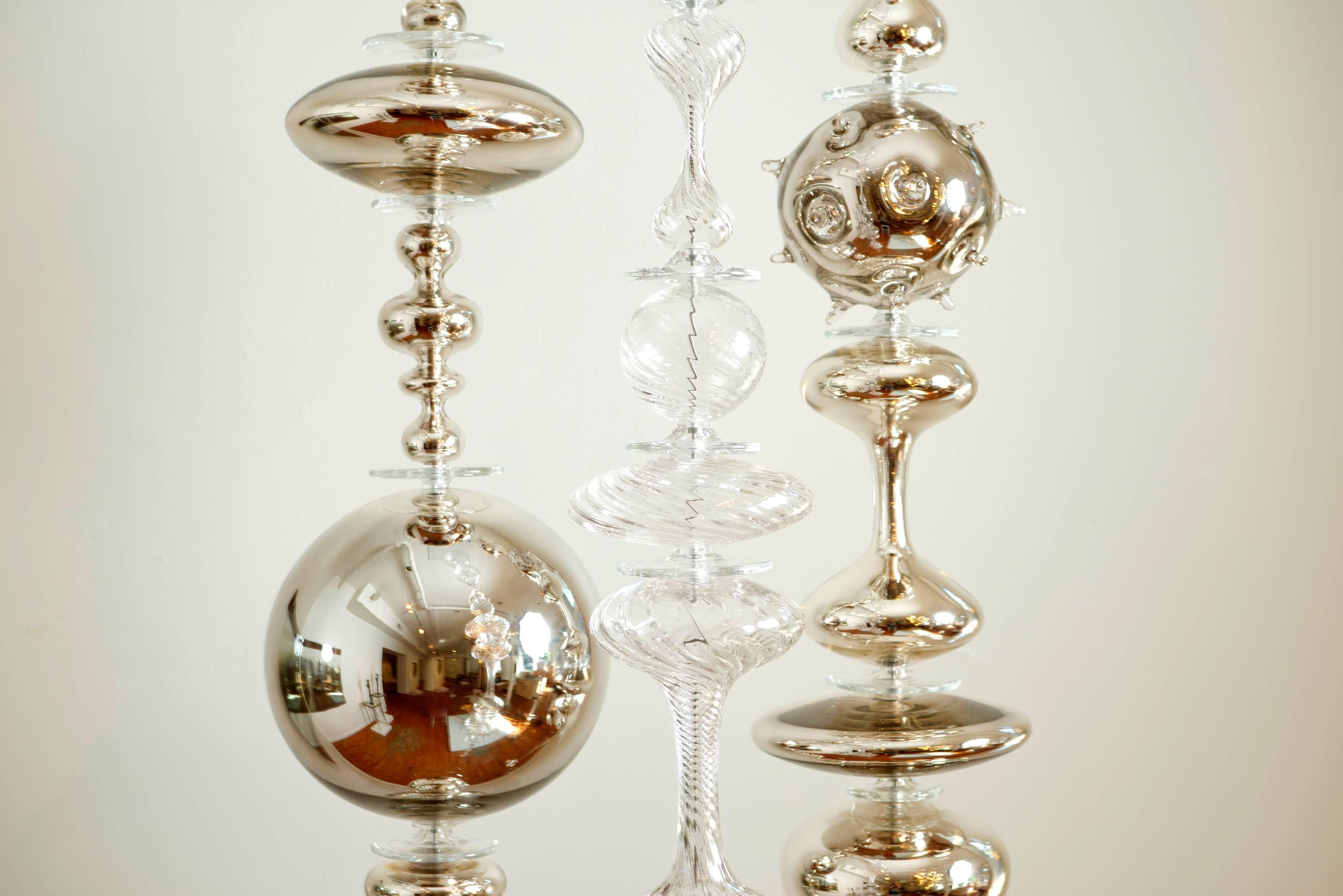 Three magnificent strands of blown, sculpted and cold worked glass elements. Each piece is handmade uniquely by the artist, Andy Paiko. Andy is a recipient of the 2015 Louis Comfort Tiffany grant, a prestigious award given to a select group of