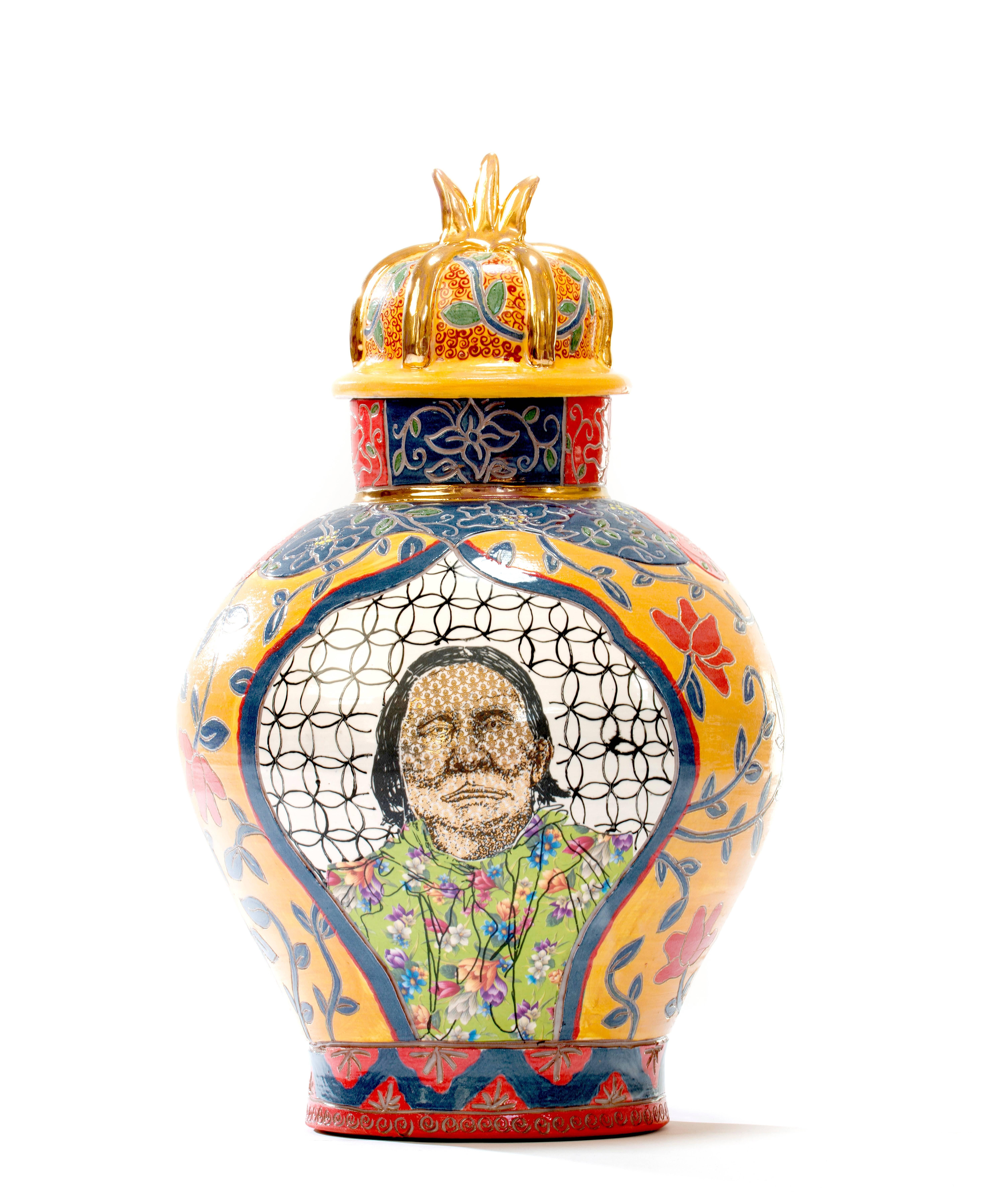 Ruth Bader Ginsberg / Geronimo Urn is made by Roberto Lugo out of porcelain, china paint and gold luster.

Best known for expertly thrown ceramic vessels that are illustrated with activists, political figures, and hip-hop legends, Lugo aims to reach