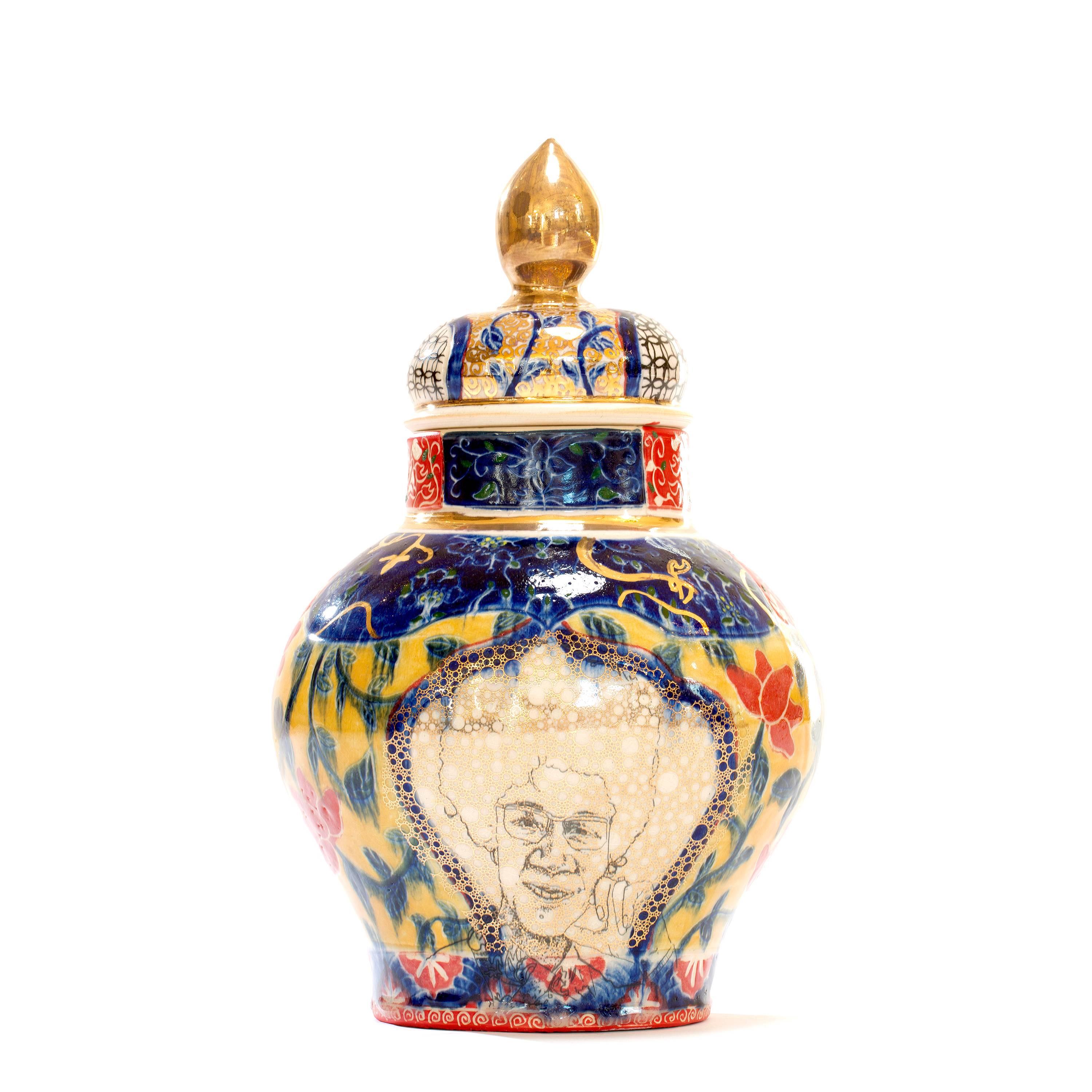 Whitney Houston / Shirley Chisholm Urn is made by Roberto Lugo out of porcelain, china paint and gold luster.

Best known for expertly thrown ceramic vessels that are illustrated with activists, political figures, and hip-hop legends, Lugo aims to