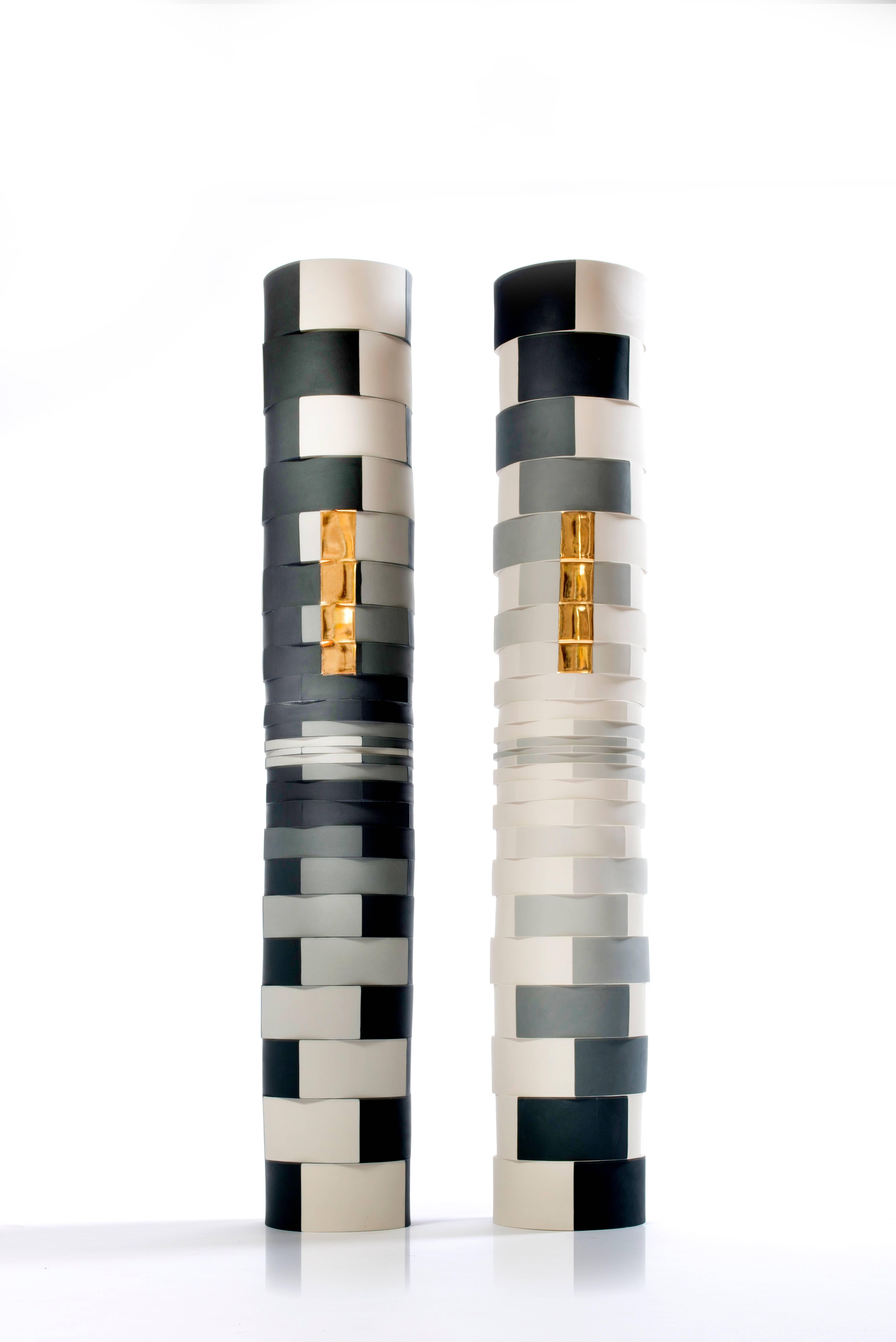 Optically mesmerizing and expertly crafted unique colored porcelain and gold luster columns by artist Peter Pincus. Each column is 6.25 x 6.25 x 38.5 inches.

Born in Rochester, NY, Peter Pincus is a ceramic artist and instructor.  He joined the