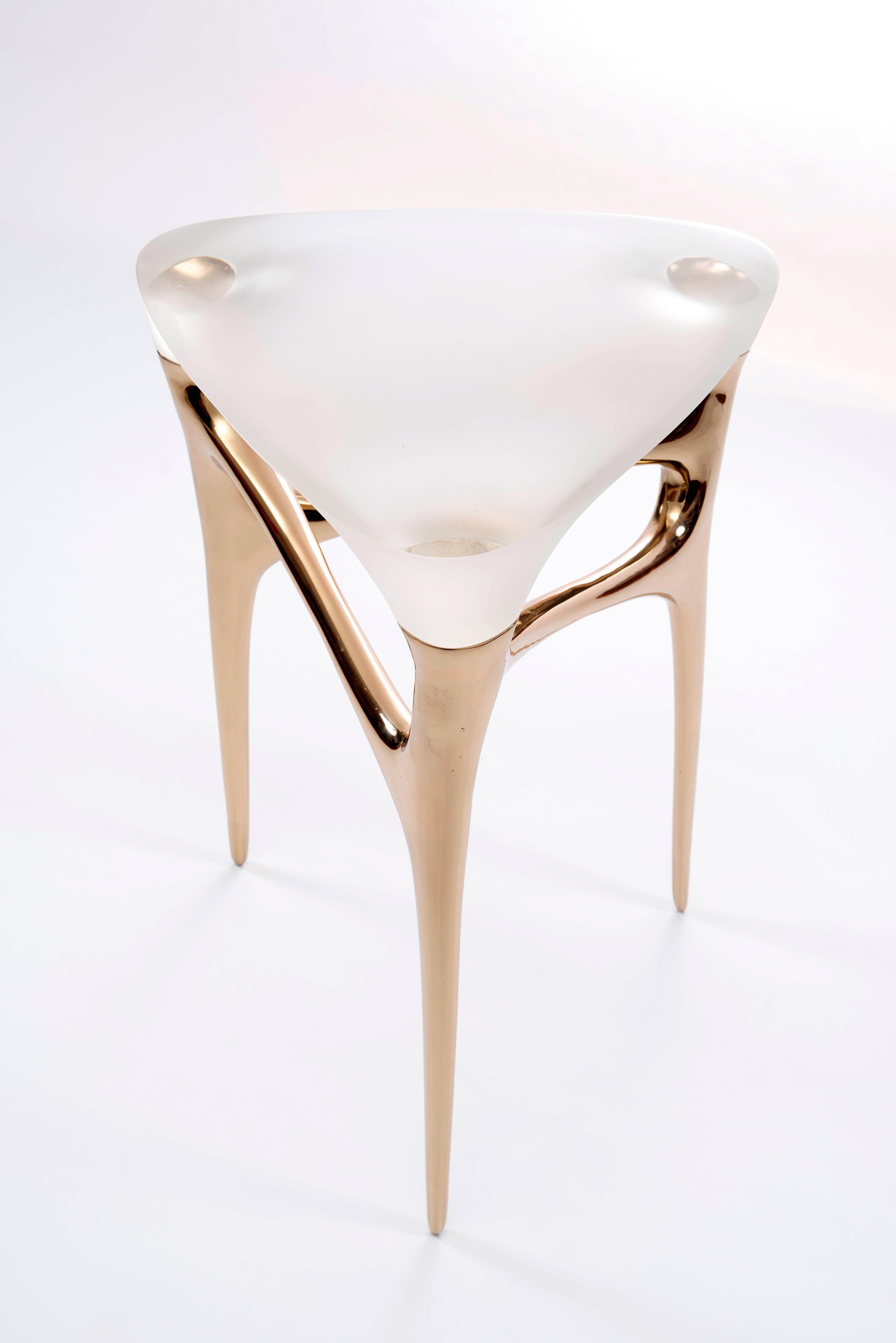 Cast bronze and cast glass side table by German designer Timothy Schreiber.

Timothy Schreiber initially trained in cabinet making in Germany before studying architecture and design at Bauhaus University, Weimar (Germany), University of Stuttgart