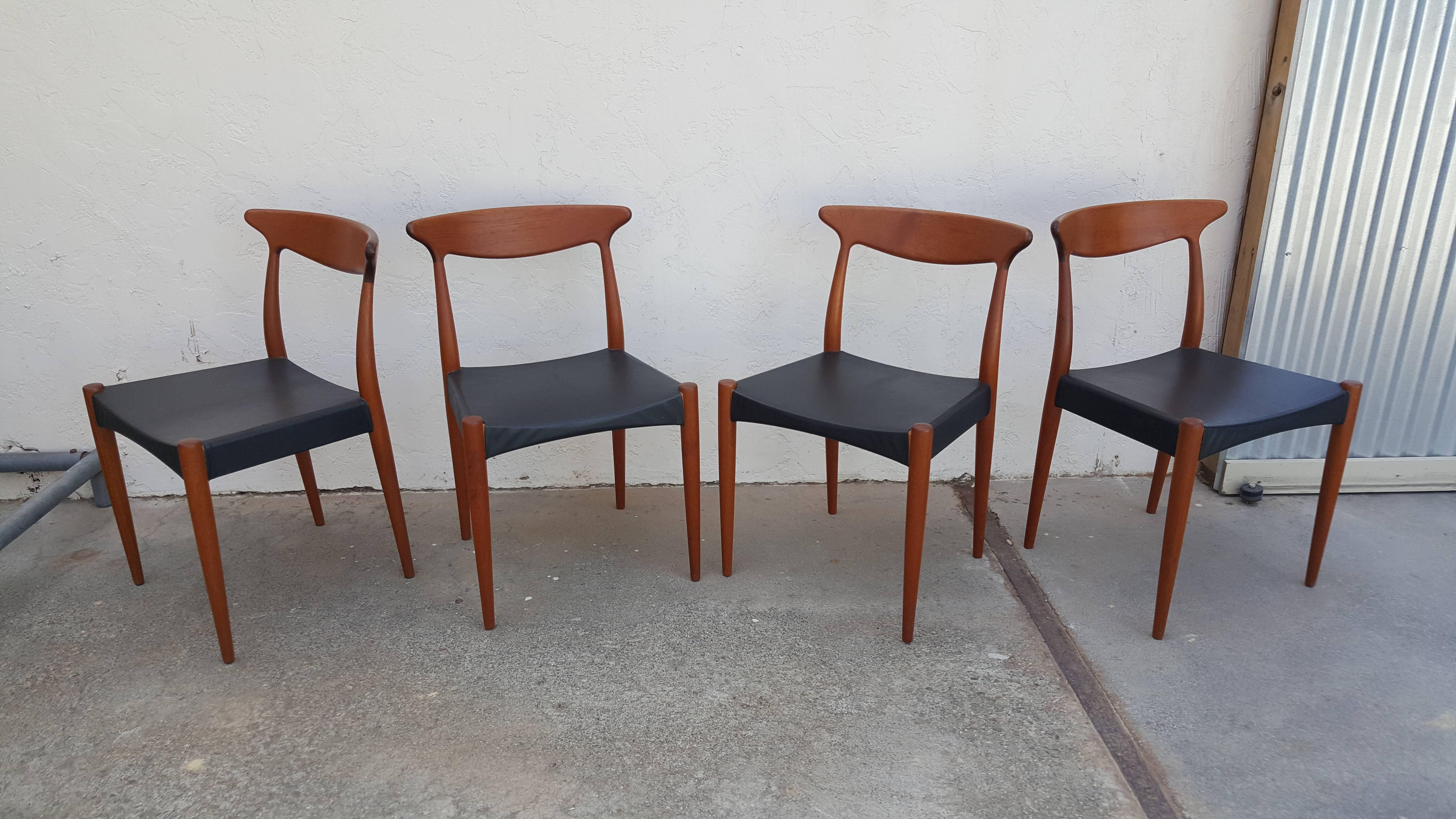 Classic Scandinavian design in this set of four teak dining chairs designed by Arne Hovmand Olsen for Mogens Kold. Excellent original finish, sturdy construction.
