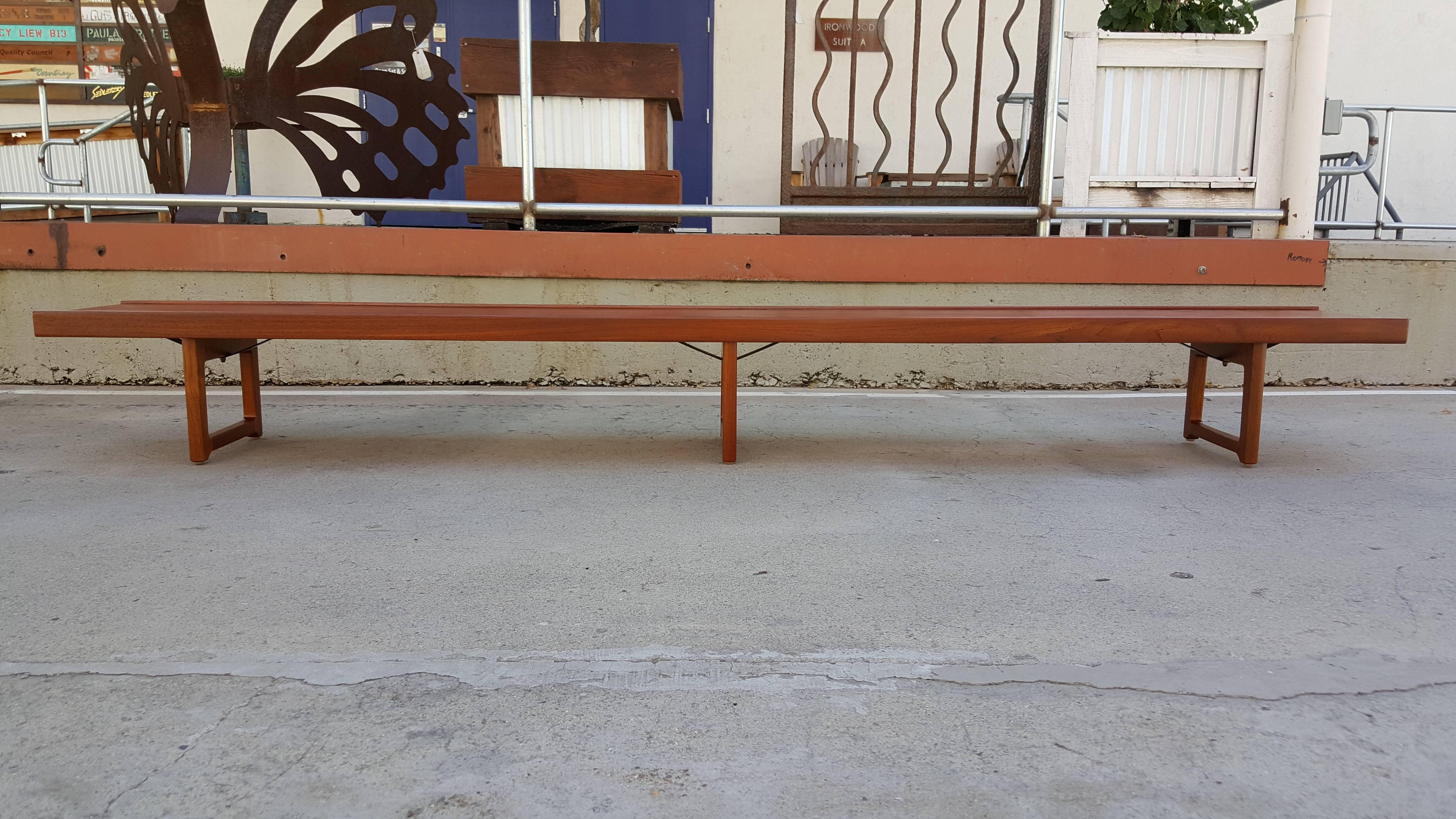 Scandinavian Modern teak bench designed by Torbjorn Afdal for Bruksbo, Norway. Measures just under 10 ft. in length. Retains makers label. Refinished.