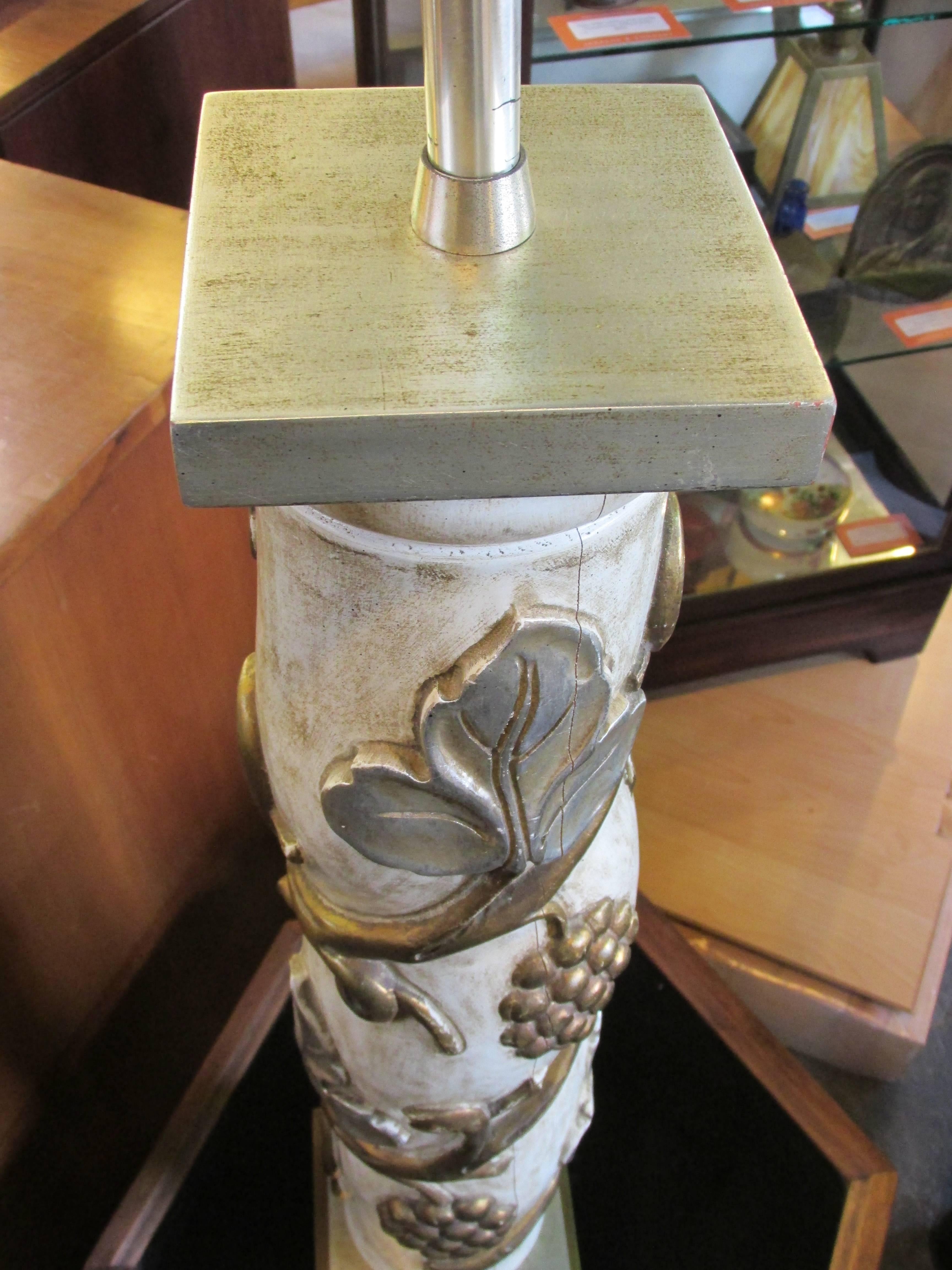 A Marbro Lamp Company, over-sized, hand carved and poly-chromed wooden column lamp with a grape motif. Dual pull chain light sockets, retains Marbro label. Sold without shade, but shade is available, with imperfections, for additional shipping