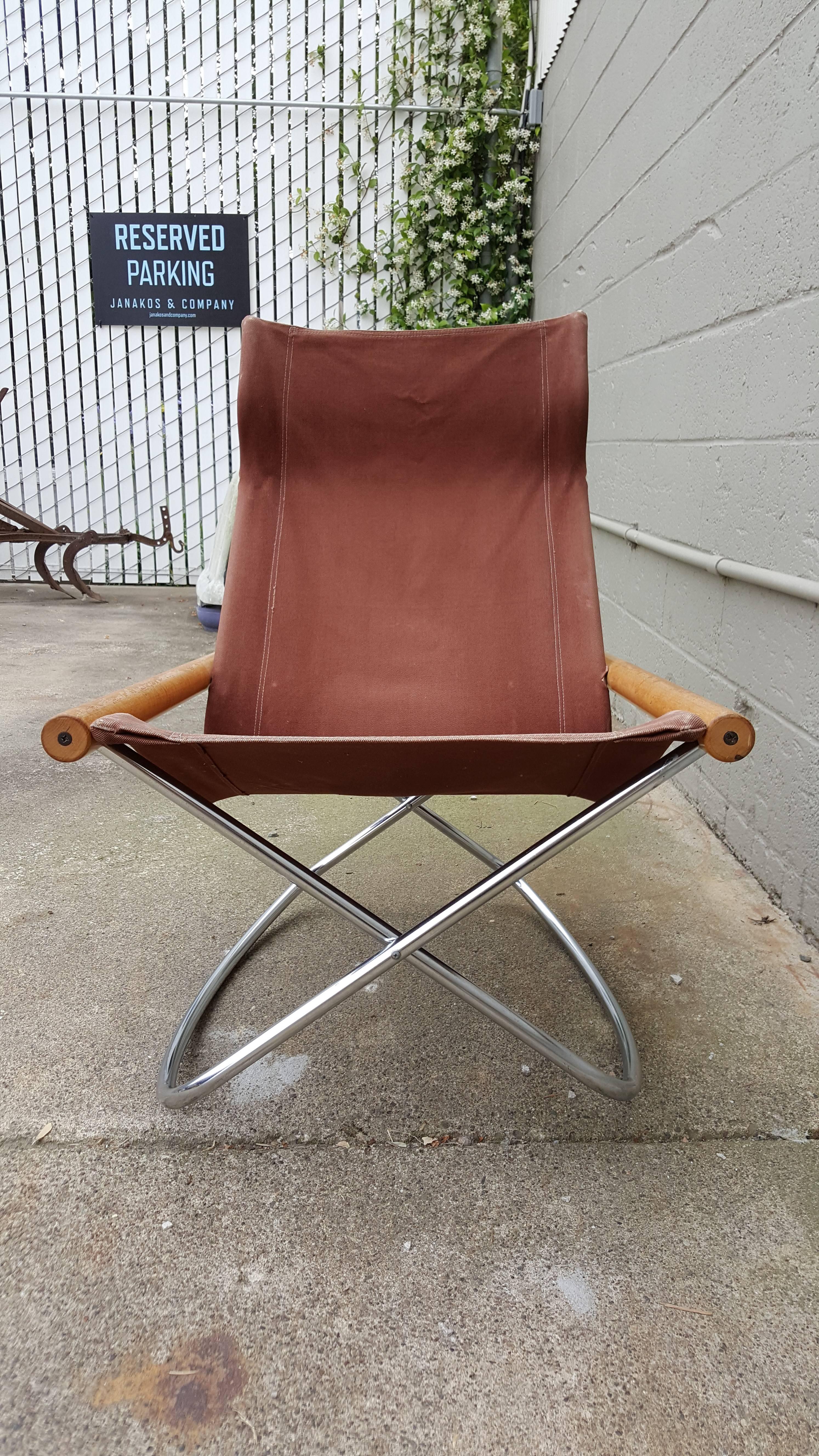 A Japanese modernist design strongly influenced by the Scandinavian Mid-Century movement. The ergonomic design of this chair provides optimal comfort. A canvas sling seat over a tubular steel chrome frame that easily folds in half. This chair was