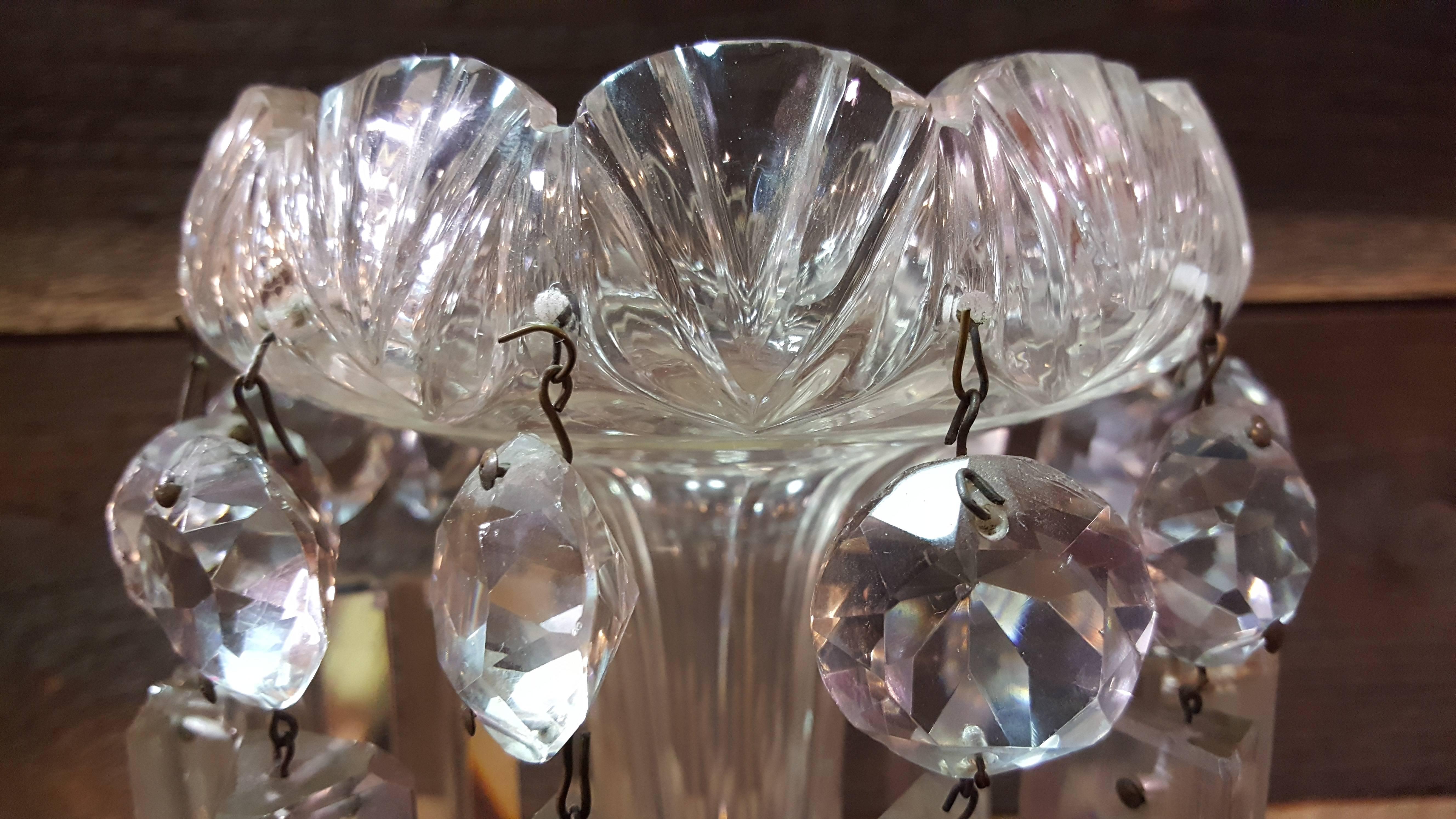 A pair of antique crystal lusters with clear cut crystal prisms and stems, circa 1880s.