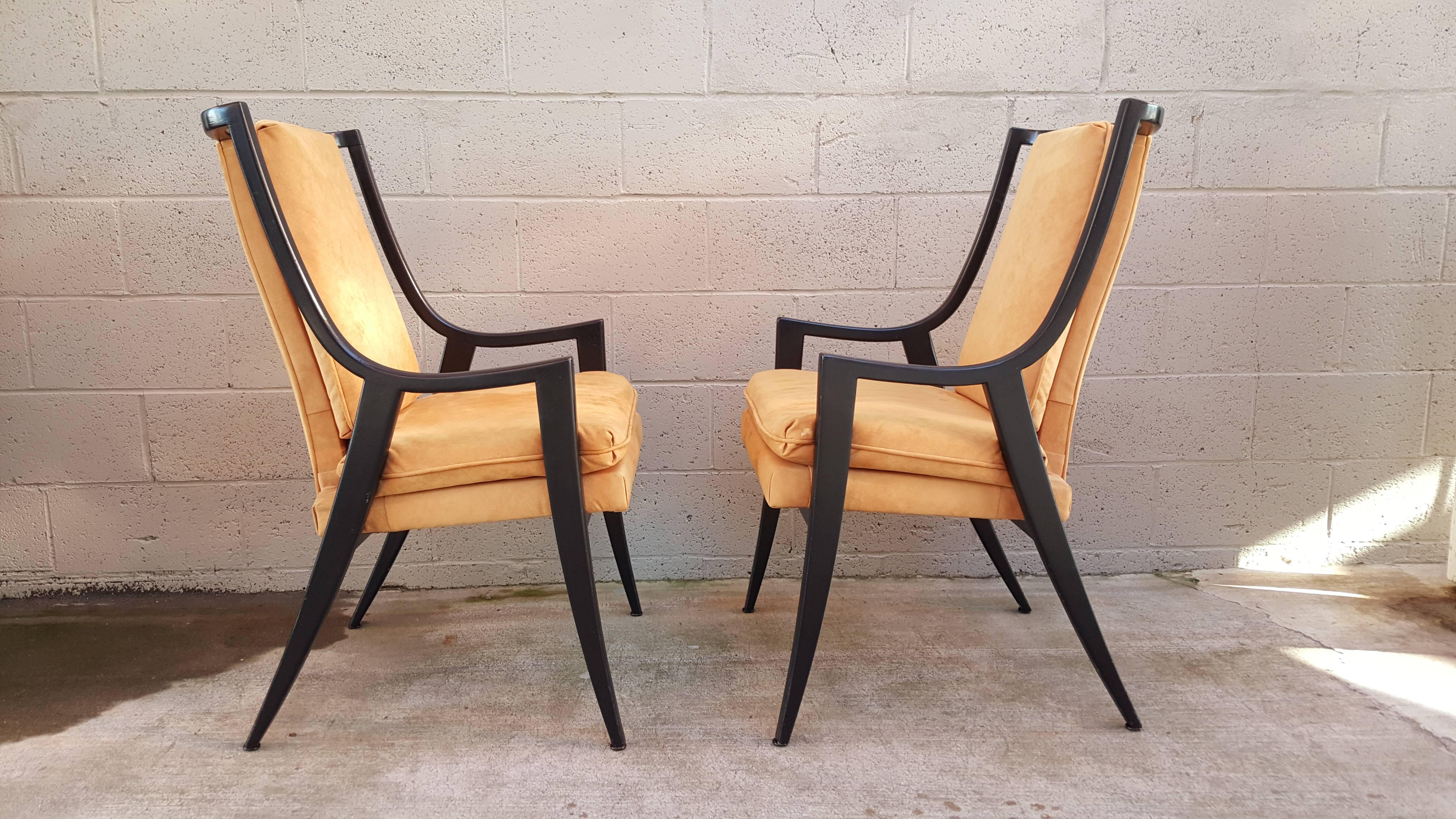 A striking set of six Mid-Century Modern dining chairs designed by Harvey Probber, circa 1950. Solid mahogany frames with original black painted finish. Older re-upholstery with a micro-suede fabric. Very good vintage condition. Multiple small