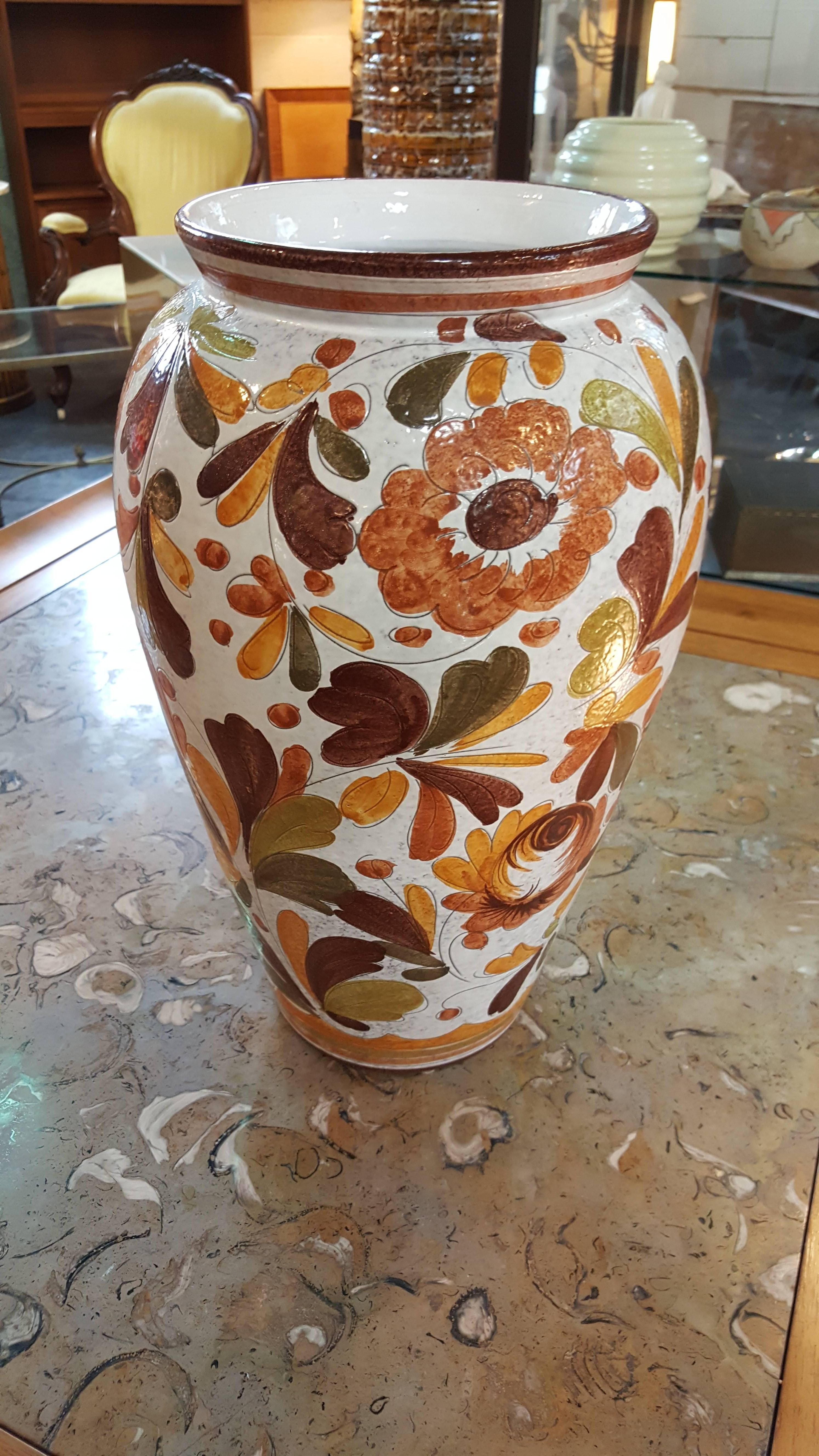 A hand-painted leaf and floral pattern, hand thrown Italian ceramic vase or jardiniere, circa 1970s.