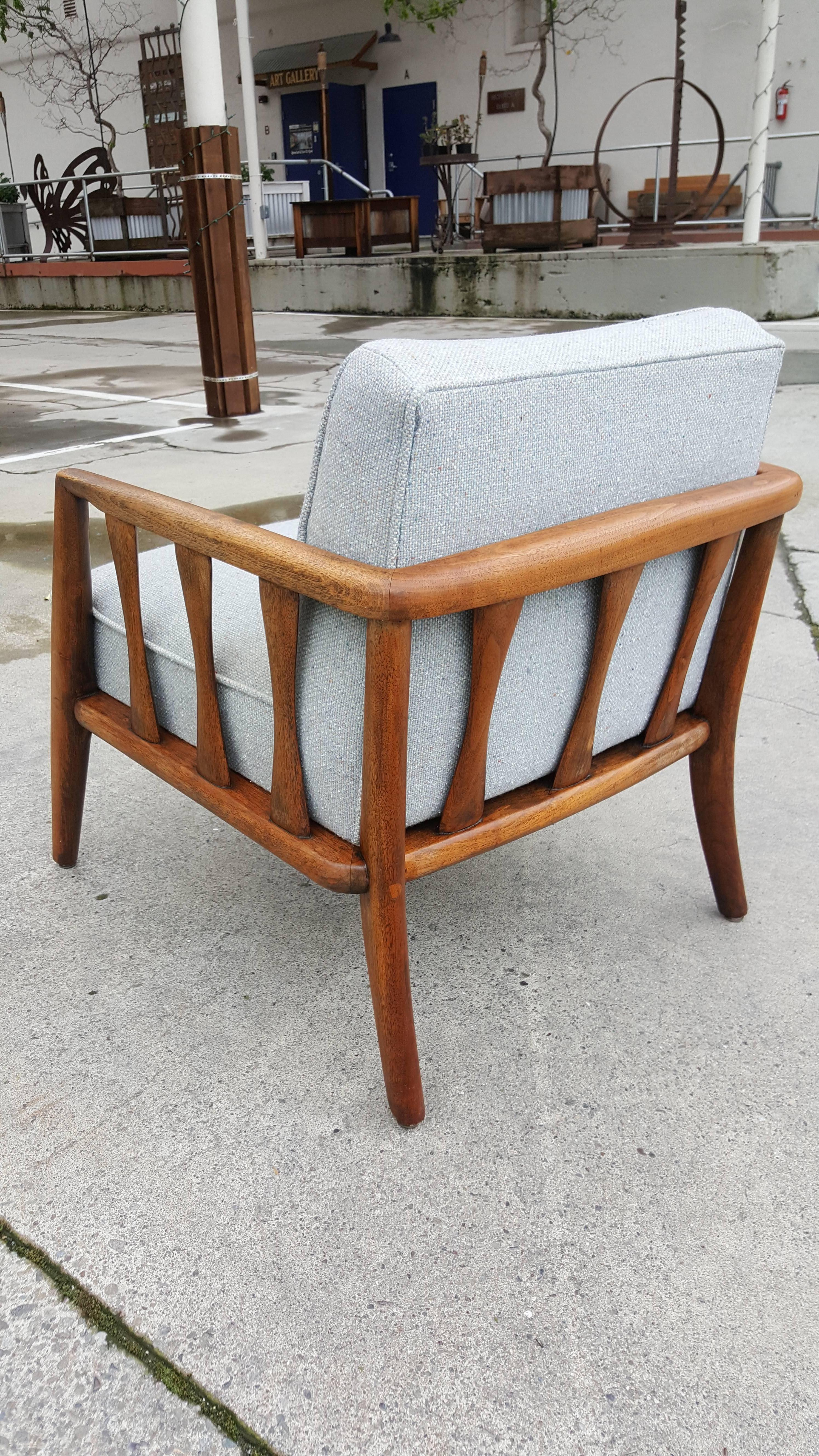 Fine craftsmanship and material in this Danish modern style solid walnut lounge chair. Notice sculpted walnut hourglass slats at sides and wrapped chair frame in the style of Folke Ohlsson.