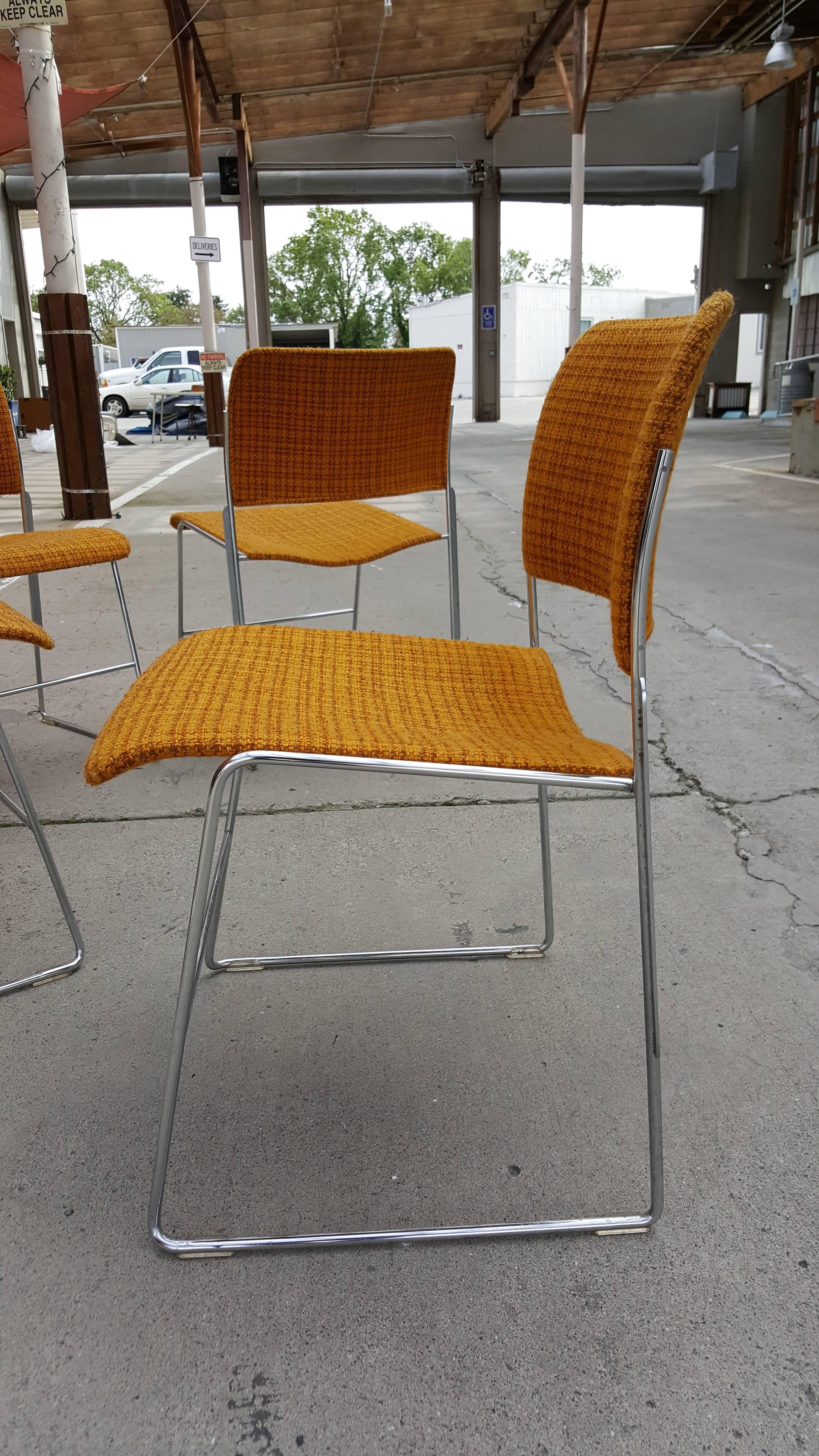 A set of four polished chrome and fabric 40/4 dining chairs designed by David Rowland, circa 1960. Textured burnt orange fabric. Very nice original condition.