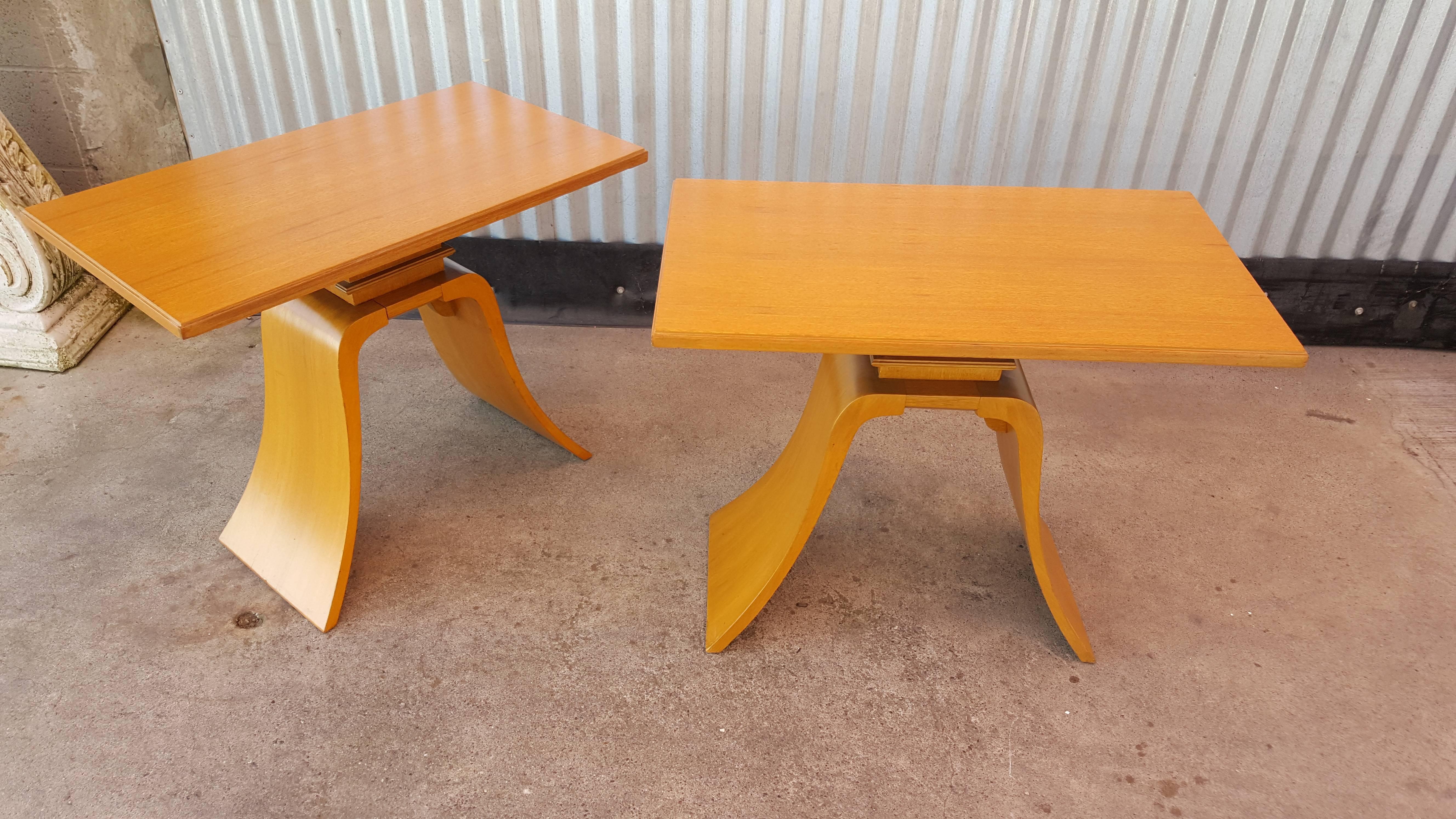Classic, elegant and unique design describes these 1940s modern end tables. Designed by Paul Frankl for Brown-Saltman of California. Sculptural bell shaped bases, machine-age style molding detail. Excellent vintage condition with newly refinished
