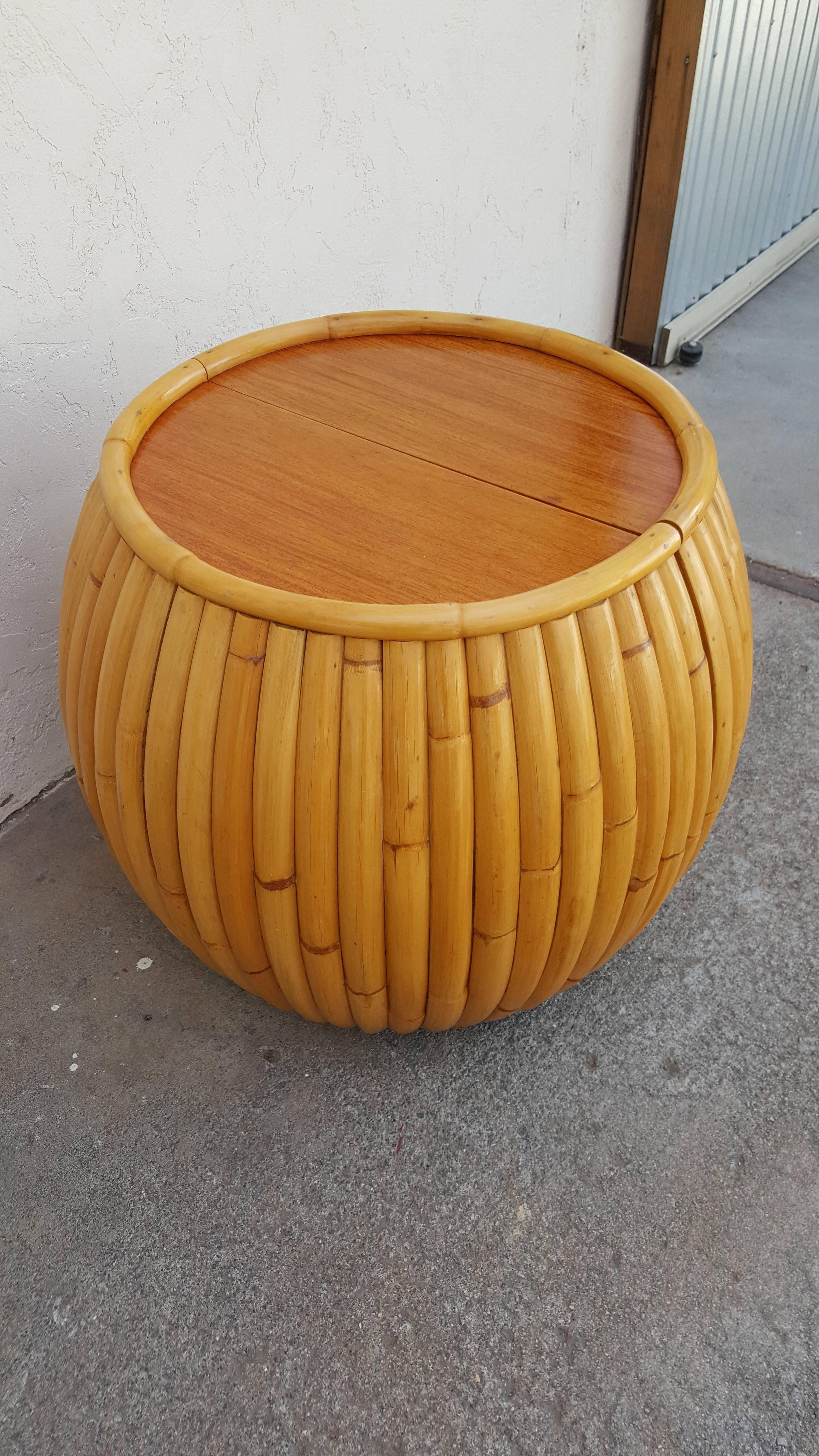 1950s bamboo end table with a concealed a dry bar. Solid mahogany interior and top surface, authentic bent bamboo exterior. Great piece for entertaining, perfect for conserving and utilizing space. Excellent original condition. Tabletop surface