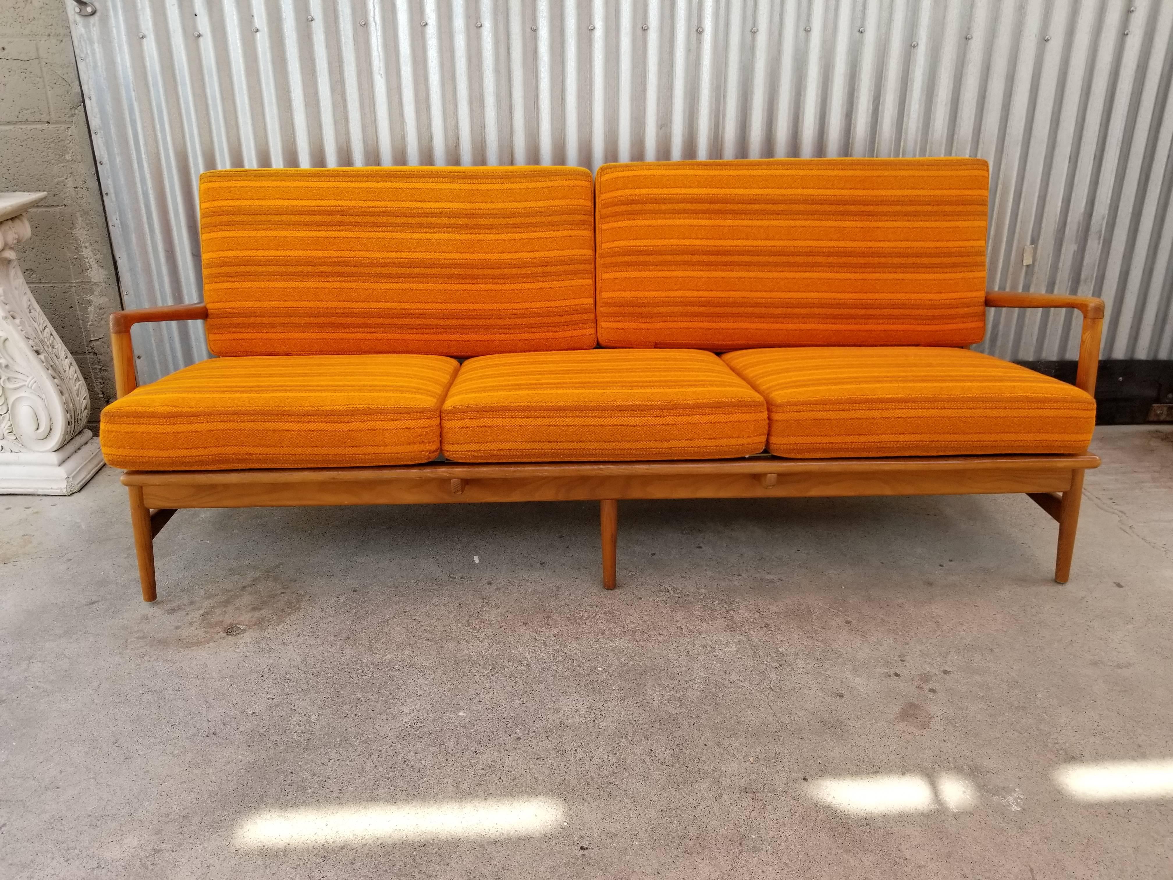 Teak Danish modern sofa designed by Ib Kofod-Larsen, Denmark, circa. 1960. New Pirelli strapping, new foam, professionally cleaned original fabric. Beautiful original finish to teak frame.