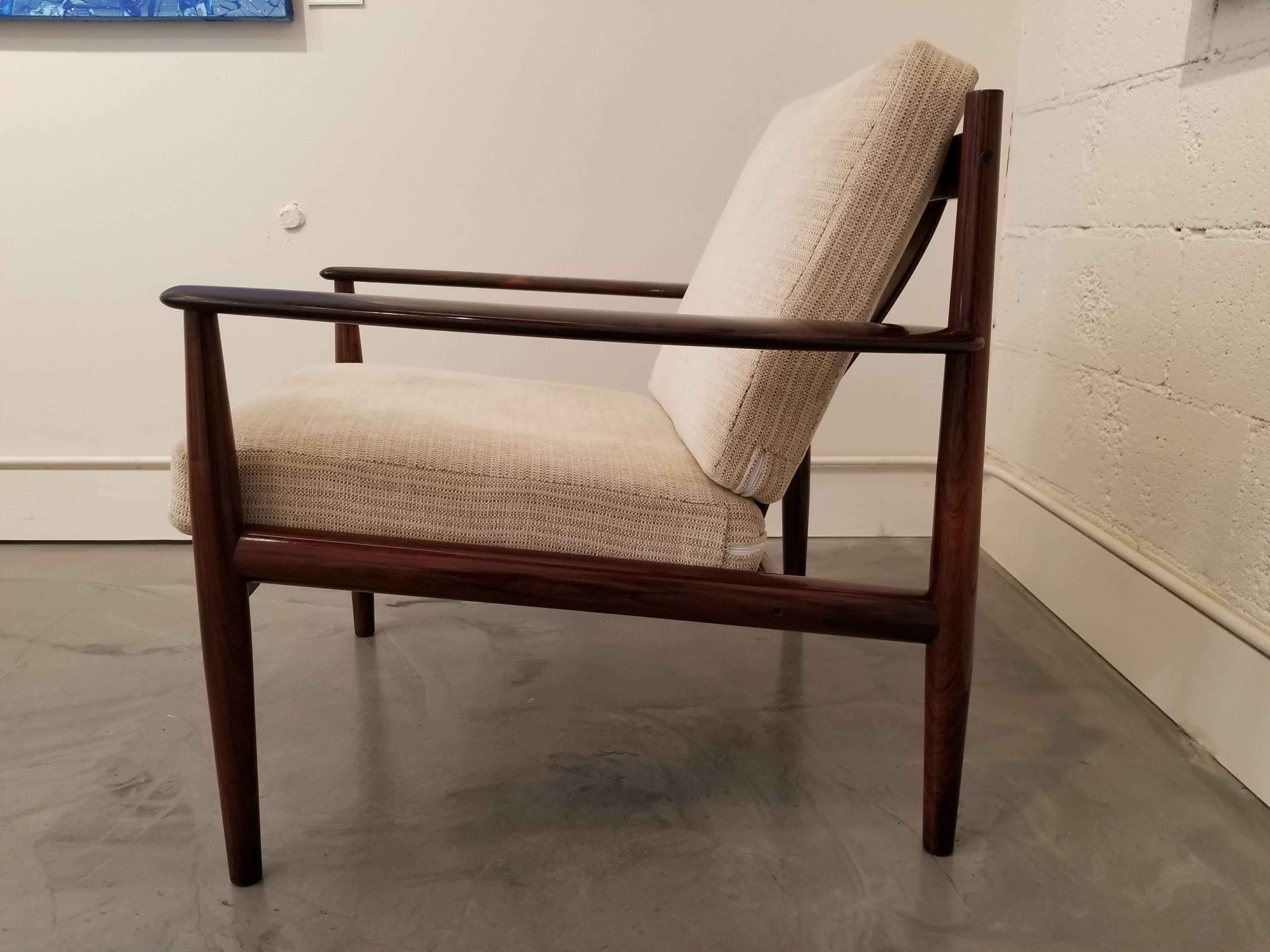 Exceptional Danish modern lounge chair by Grete Jalk for France & Son, circa 1960s. Notice figured detail to wood grain. Signed.