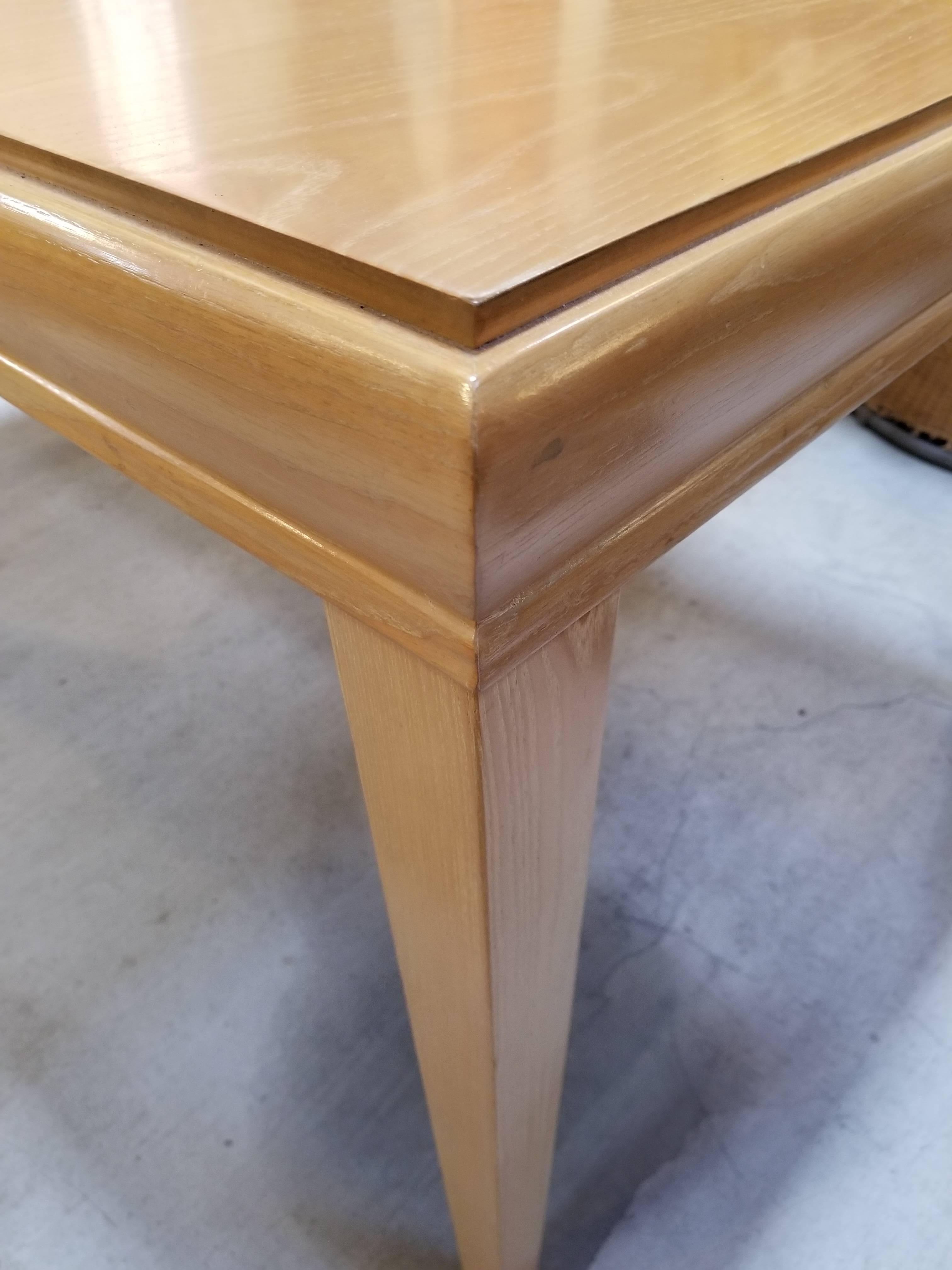 1940s expanding dining table in the style of Paul Frankl or Paul Laszlo. Beautiful, original cerused oak finish. Solid oak tapered legs. Includes two 12 inch leaves.
